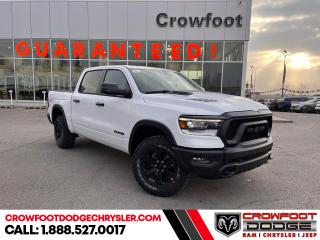 <b>Sunroof, Night Edition, Blind Spot Detection, RamBox, Trailer Hitch!</b><br> <br> <br> <br>  Work, play, and adventure are what the 2023 Ram 1500 was designed to do. <br> <br>The Ram 1500s unmatched luxury transcends traditional pickups without compromising its capability. Loaded with best-in-class features, its easy to see why the Ram 1500 is so popular. With the most towing and hauling capability in a Ram 1500, as well as improved efficiency and exceptional capability, this truck has the grit to take on any task.<br> <br> This bright white Crew Cab 4X4 pickup   has an automatic transmission and is powered by a  395HP 5.7L 8 Cylinder Engine.<br> <br> Our 1500s trim level is Rebel. Bold and unapologetic, this Ram 1500 Rebel features beefy off-road suspension including Bilstein dampers, skid plates for underbody protection, gloss black wheels, front fog lamps, power-folding exterior mirrors with courtesy lamps, and black fender flares, with front bumper tow hooks. The standard features continue, with power-adjustable heated front seats with lumbar support, dual-zone climate control, power-adjustable pedals, deluxe sound insulation, and a leather-wrapped steering wheel. Connectivity is handled by an upgraded 8.4-inch display powered by Uconnect 5 with inbuilt navigation, mobile internet hotspot access, Apple CarPlay, Android Auto and SiriusXM streaming radio. Additional features include a power rear window with defrosting, class II towing equipment including a hitch, wiring harness and trailer sway control, heavy-duty suspension, cargo box lighting, and a locking tailgate. This vehicle has been upgraded with the following features: Sunroof, Night Edition, Blind Spot Detection, Rambox, Trailer Hitch. <br><br> <br>To apply right now for financing use this link : <a href=https://www.crowfootdodgechrysler.com/tools/autoverify/finance.htm target=_blank>https://www.crowfootdodgechrysler.com/tools/autoverify/finance.htm</a><br><br> <br/> Total  cash rebate of $9148 is reflected in the price. Credit includes up to 10% MSRP. <br> Buy this vehicle now for the lowest bi-weekly payment of <b>$489.50</b> with $0 down for 96 months @ 5.49% APR O.A.C. ( Plus GST  documentation fee    / Total Obligation of $101817  ).  Incentives expire 2024-02-29.  See dealer for details. <br> <br>We pride ourselves in consistently exceeding our customers expectations. Please dont hesitate to give us a call.<br> Come by and check out our fleet of 80+ used cars and trucks and 180+ new cars and trucks for sale in Calgary.  o~o