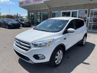 <div>Used | SUV | White | 2017 | Ford | Escape | SE | 4WD | Heated Seats</div><div> </div><div><div>Ready to escape the ordinary? Our 2017 Ford Escape SE promises to be the trusty sidekick you didnt know you needed---like a superhero, but with better gas mileage and enough trunk space for all your capes (or groceries).</div><div>Navigating the urban jungle or reversing into that ridiculously tight spot at the supermarket? Fear not! The backup camera is your rear-view oracle, a modern-day soothsayer that peeks into the future to ensure its free of shopping carts and stray cats. Its not just about seeing whats behind you, its about foreseeing a hassle-free parking experience every single time.</div><div>Winter mornings can feel like an episode of Survivor, but inside this Escape, youre wrapped in the cozy embrace of heated seats---because the only thing better than a warm cookie is a warm seat on a frosty day. Its like having a personal campfire, minus the smoke and the need to gather wood.</div><div>If youre looking for a ride that checks all the boxes---style, comfort, and a touch of clairvoyance---this 2017 Ford Escape SE is waiting to whisk you away on your next adventure, whether its a trek across the city or a getaway to somewhere quiet. Why settle for just traveling when you can truly escape?</div><div> </div></div><div>2017 FORD ESCAPE SE WITH 146372 KMS, BACKUP CAMERA, HEATED SEATS, PADDLE SHIFTERS, BLUETOOTH, USB, AUX, CD, RADIO, POWER WINDOWS LOCKS SEATS, AC AND MORE!</div>