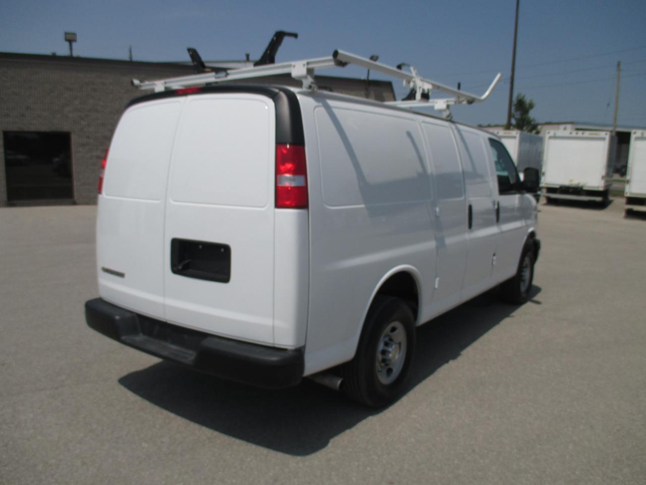 2022 Chevrolet Express 2500 RWD 2500 135" with roof racks and cargo shelves. - Photo #5