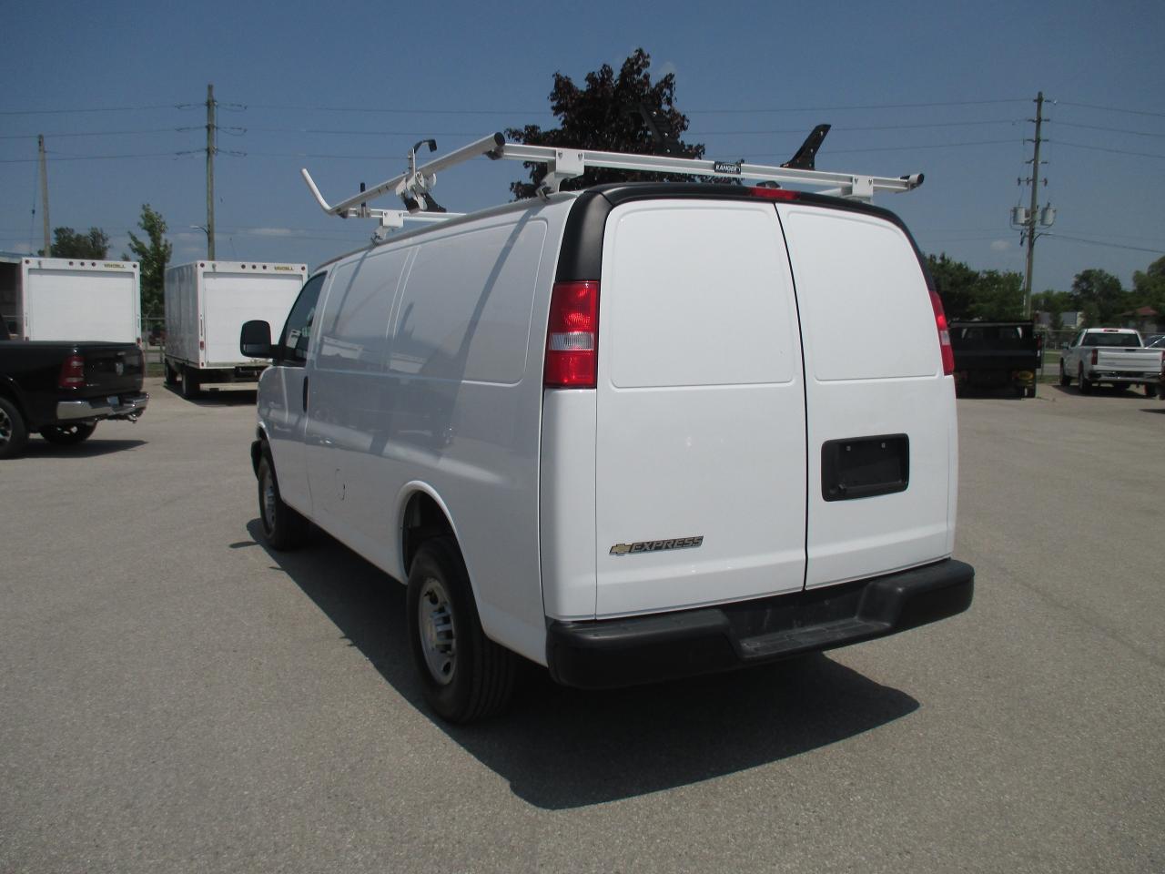 2022 Chevrolet Express 2500 RWD 2500 135" with roof racks and cargo shelves. - Photo #6