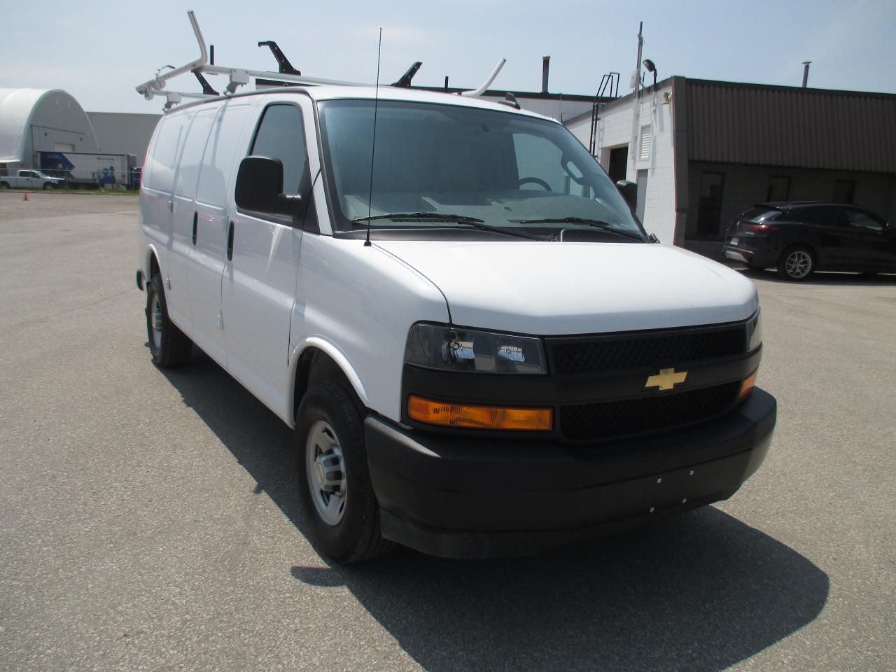 2022 Chevrolet Express 2500 RWD 2500 135" with roof racks and cargo shelves. - Photo #3