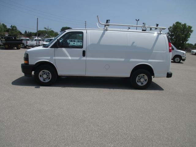 2022 Chevrolet Express 2500 RWD 2500 135" with roof racks and cargo shelves.