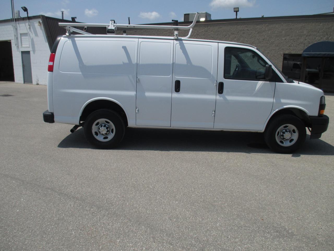 2022 Chevrolet Express 2500 RWD 2500 135" with roof racks and cargo shelves. - Photo #4
