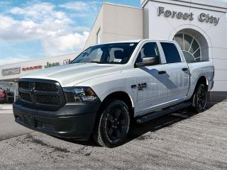 <b>Heavy Duty Suspension,  Tow Package,  Power Mirrors,  Rear Camera!</b><br> <br>   This Ram 1500 Classic is a top contender in the full-size pickup segment thanks to a winning combination of a strong powertrain, a smooth ride and a well-trimmed cabin. <br> <br>The reasons why this Ram 1500 Classic stands above its well-respected competition are evident: uncompromising capability, proven commitment to safety and security, and state-of-the-art technology. From its muscular exterior to the well-trimmed interior, this 2023 Ram 1500 Classic is more than just a workhorse. Get the job done in comfort and style while getting a great value with this amazing full-size truck. <br> <br> This bright white Crew Cab 4X4 pickup   has an automatic transmission and is powered by a  5.7L V8 16V MPFI OHV engine.<br> <br> Our 1500 Classics trim level is Tradesman. This Ram 1500 Tradesman is ready for whatever you throw at it, with a great selection of standard features such as class II towing equipment including a hitch, wiring harness and trailer sway control, heavy-duty suspension, cargo box lighting, and a locking tailgate. Additional features include heated and power adjustable side mirrors, UCconnect 3, cruise control, air conditioning, vinyl floor lining, and a rearview camera. This vehicle has been upgraded with the following features: Heavy Duty Suspension,  Tow Package,  Power Mirrors,  Rear Camera. <br><br> View the original window sticker for this vehicle with this url <b><a href=http://www.chrysler.com/hostd/windowsticker/getWindowStickerPdf.do?vin=1C6RR7KT1PS573721 target=_blank>http://www.chrysler.com/hostd/windowsticker/getWindowStickerPdf.do?vin=1C6RR7KT1PS573721</a></b>.<br> <br>To apply right now for financing use this link : <a href=https://www.forestcitydodge.ca/finance-center/ target=_blank>https://www.forestcitydodge.ca/finance-center/</a><br><br> <br/> Weve discounted this vehicle $970. 6.99% financing for 96 months.  Incentives expire 2023-10-02.  See dealer for details. <br> <br><br> Forest City Dodge proudly serves clients in London ON, St. Thomas ON, Woodstock ON, Tilsonburg ON, Strathroy ON, and the surrounding areas. Formerly known as Southwest Chrysler, Forest City Dodge has become a local automotive leader that takes pride in providing a transparent car buying experience and exceptional customer service throughout the dealership. </br>

<br> If you are looking to finance a vehicle, our finance department are seasoned professionals in ensuring that you get financing options that fits your budget and lifestyle. Regardless of your credit situation, our finance team will work hard to get you approved for a vehicle youre comfortable with in no time. We also offer a dedicated service department thats always ready to attend your needs. Our factory trained technicians will help keep your vehicle in the best shape possible so that your vehicle gets the most out of its lifespan. </br>

<br> We have a strong and committed team with many years of experience satisfying our customers needs. Feel free to browse our inventory online, request more information about our vehicles, or inquire about financing. Visit us today at or contact us now with any questions or concerns! </br>
<br> Come by and check out our fleet of 80+ used cars and trucks and 200+ new cars and trucks for sale in London.  o~o