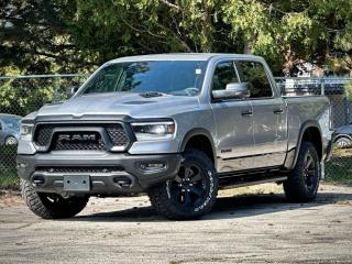 **Please note** An additional charge of $998 and $799 will be applied to this vehicle for Dealer-Installed Running Boards & LineX Bedliner.  Our New 2024 RAM 1500 Rebel Crew Cab 4X4 with the Level 2 Equipment Pack, G/T Pack, and Night Edition is an aggressive adventure machine that defies the ordinary in Billet Silver Metallic w/ Diamond Black Crystal Pearl Two-Tone! Powered by a 5.7 Litre eTorque HEMI V8 supplying 395hp to an 8 Speed Automatic transmission for trail-friendly travels. This Four Wheel Drive truck also features versatile capability with a raised ride height, an electronic locking rear axle, robust skid plates, and a Class III bumper hitch, and it sees approximately 10.7L/100km on the highway. Our RAM shows its rebellious nature with LED lighting, fog lamps, a powder-coated front bumper, a sport performance hood, lower two-tone paint, alloy wheels, off-road fender flares, a panoramic vista sunroof, and our Level 2 Pack for multifunction mirrors.  Rewarding features in our Rebel cabin come from our Level 2 Pack, which adds heated front seats, a heated premium steering wheel, power-adjustable pedals, a power rear window, 19-speaker Harman Kardon audio, remote start, and a 12-inch touchscreen. It complements standard features such as dual-zone automatic climate control, a 12.3-inch driver display, full-color navigation, WiFi compatibility, Android Auto®/Apple CarPlay®, Bluetooth®, and voice control.  RAM helps seal the deal with intelligent safety from forward collision warning, automatic braking, a rearview camera, hill start assistance, hill descent control, tire pressure monitoring, trailer sway damping, and more. With all that, our 1500 Rebel takes on tough challenges like a champ! Save this Page and Call for Availability. We Know You Will Enjoy Your Test Drive Towards Ownership!