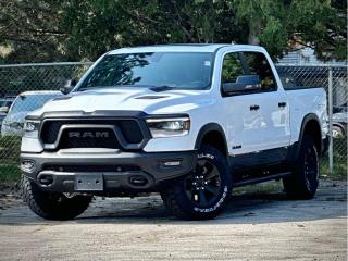 **PLEASE NOTE: Additional charges of $998 and $799 will be applied for Dealer-Installed running boards and LineX Bed Liner.**  Our New 2024 RAM 1500 Rebel Crew Cab 4X4 with the Level 2 Equipment Pack, G/T Pack, and Night Edition is an aggressive adventure machine that defies the ordinary in Bright White w/ Diamond Black Crystal Pearl Two-Tone! Powered by a 5.7 Litre eTorque HEMI V8 supplying 395hp to an 8 Speed Automatic transmission for trail-friendly travels. This Four Wheel Drive truck also features versatile capability with a raised ride height, an electronic locking rear axle, robust skid plates, and a Class III bumper hitch, and it sees approximately 10.7L/100km on the highway. Our RAM shows its rebellious nature with LED lighting, fog lamps, a powder-coated front bumper, running boards, class IV hitch receiver, a massive sunroof, a sport performance hood, lower two-tone paint, alloy wheels, off-road fender flares, and our Level 2 Pack for multifunction mirrors.  Rewarding features in our Rebel cabin come from our Level 2 Pack, which adds heated front seats, a heated premium steering wheel, power-adjustable pedals, a power rear window, 19-speaker Harman Kardon audio, remote start, and a 12-inch touchscreen. It complements standard features such as dual-zone automatic climate control, a 12.3-inch driver display, full-color navigation, WiFi compatibility, Android Auto®/Apple CarPlay®, Bluetooth®, and voice control.  RAM helps seal the deal with intelligent safety from forward collision warning, automatic braking, a rearview camera, hill start assistance, hill descent control, tire pressure monitoring, trailer sway damping, and more. With all that, our 1500 Rebel takes on tough challenges like a champ! Save this Page and Call for Availability. We Know You Will Enjoy Your Test Drive Towards Ownership!