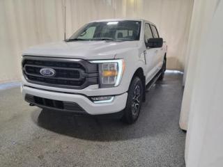This all new 2022 Ford F-150 XLT High Package 302A looks absolutely stunning in Space White Metallic. This truck comes with the ever popular 2.7L EcoBoost engine. This remarkable engine not only produces 325 horsepower and 400 ft pounds of torque, but by leveraging the EcoBoost technology and a 10-speed automatic transmission. This 4-wheel drive truck also has a 9,100 lbs. towing capacity.

Key Features:
Twin Panel Moonroof 
FX4 Off Road Package 
Power Adjustable Pedals
XLT Sport Package
8 LCD Productivity Screen in Instrument Cluster
Remote Start System
LED Reflector Head Lights & LED Fog Lights
Boxlink Cargo Management System W/Locking Cleats 
Apple Car Play/Android Auto 
FordPass Connect 
Dual-Zone Climate Control W/Automatic Temperature Control
4G Wi-Fi Modem 
10-Way Power Drivers Seat
Backup Camera 
Automatic High Beam 
Reverse Brake Assist 
Post-Collision Braking 
MyKey 4.2 LCD Productivity Screen (In Gauge Cluster) 
Keyless Entry Keypad 
Lane Keeping System 
BLIS Pre-Collision Assist
4X4

Saskatchewan has a rough climate, but the F150 tough pickup leverages physical features and technology that will keep you comfortable and safe. This truck is loaded right up and includes 18 wheels, 8 productivity screen in instrument cluster, BLIS w/trailer tow coverage, dual-zone climate control, wrapped steering wheel, rear under seat storage, SecuriCode keyless entry keypad, power-sliding rear window, trailer tow package, 10-way power drivers seat, class IV hitch, Ford Pass, Bluetooth, 7 speakers, pedestrian detection, forward collision warning, dynamic brake system, lane-keeping alert, lane-keeping aid, driver alert, automatic high beam, onboard 400W outlet, reverse brake assist, post-collision braking, BLIS (blind spot information system), remote start, remote tailgate release, LED reflector headlamps, LED fog lamps, LED high mount stop lights, lane keeping assist, rear view camera, post collision braking, trailer sway control, auto high beam, power tailgate lock, remote start and so much more. 

Bennett Dunlop Ford has been located at 770 Broad St, in the heart of Regina for over 40 years! Our 4.6 Star google review (Well over 1,800 reviews) is the result of our commitment to providing the fastest, easiest and most fun customer experience possible. Our customers tell us that they love that we dont charge any admin or documentation fees, our sales team will simply offer our best price upfront and we have a no-questions-asked money back guarantee just in case you change your mind after your purchase.