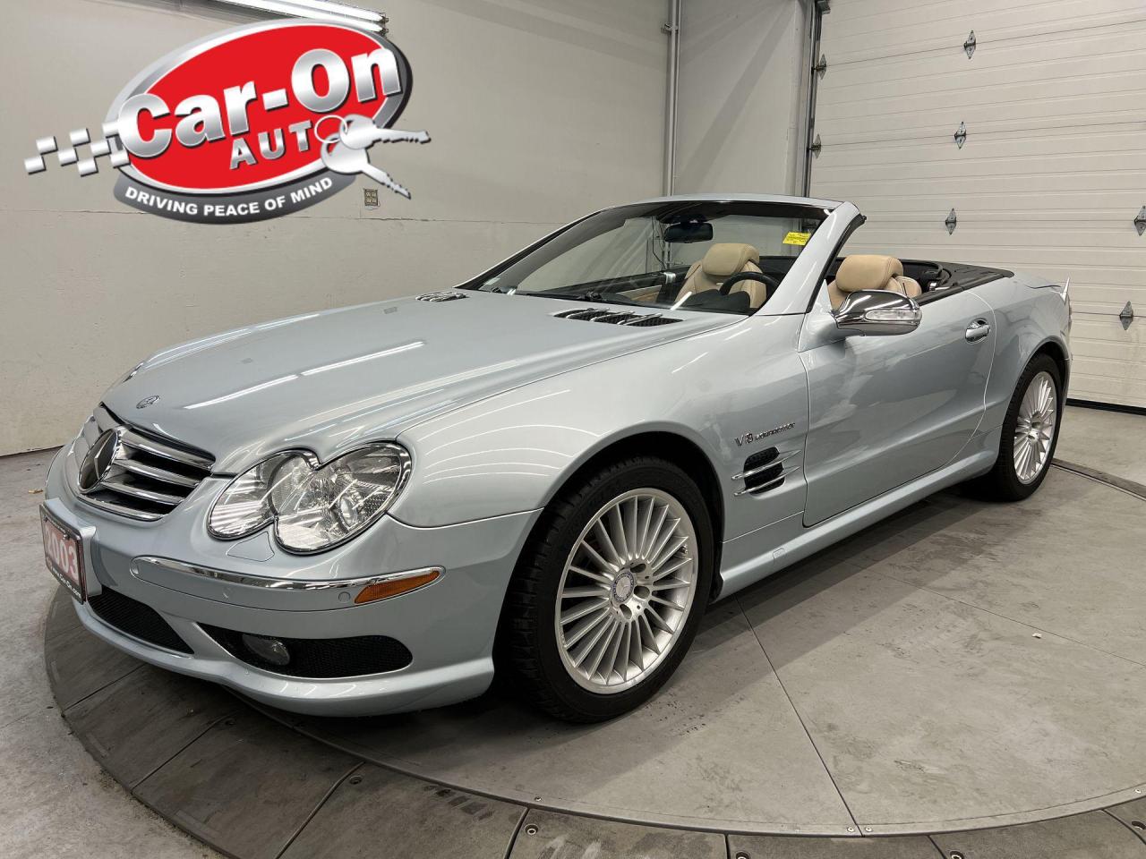 ONLY 45,000 KMS!! SL55 AMG W/ 493HP SUPERCHARGED V8 AND POWER CONVERTIBLE HARD-TOP!! Absolutely loaded w/ heated/cooled Designo leather massage seats, Distronic adaptive cruise control, staggered 18-inch AMG alloys, Bose premium audio, front & rear park sensors, drilled brake rotors, keyless go, active air suspension w/ sport mode, dual-zone climate control, full power group incl. power seats w/ driver memory, garage door opener, automatic headlights, AM/FM/CD player and more!