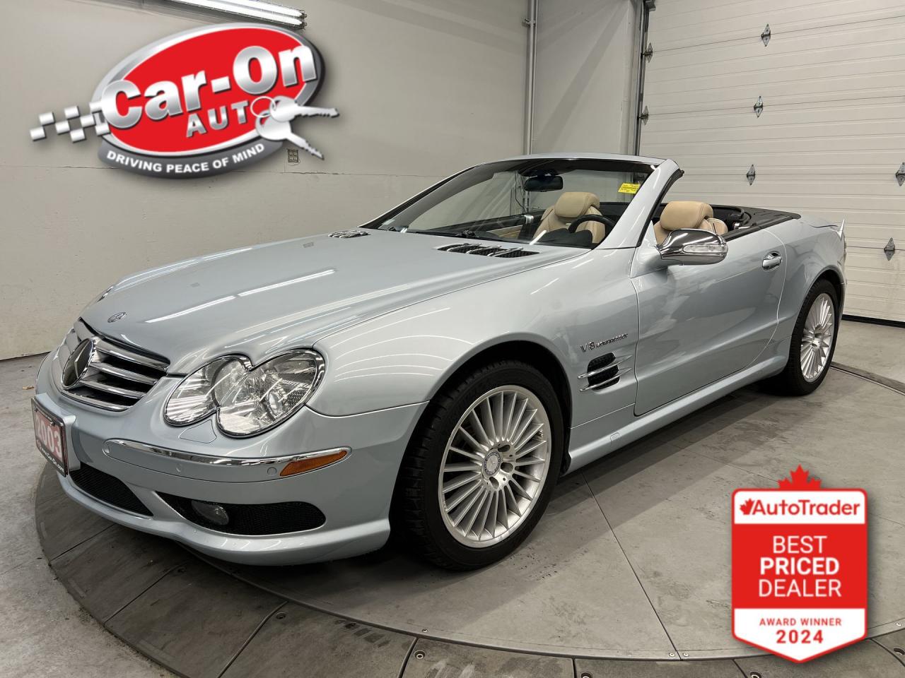 ONLY 45,000 KMS!! SL55 AMG W/ 493HP SUPERCHARGED V8 AND POWER CONVERTIBLE HARD-TOP!! Absolutely loaded w/ heated/cooled Designo leather massage seats, Distronic adaptive cruise control, staggered 18-inch AMG alloys, Bose premium audio, front & rear park sensors, drilled brake rotors, keyless go, active air suspension w/ sport mode, dual-zone climate control, full power group incl. power seats w/ driver memory, garage door opener, automatic headlights, AM/FM/CD player and more!