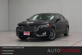 <p>Our 2019 Ford Fusion Hybrid Titanium Sedan stands out in style with a sophisticated Agate Black appearance! Powered by a 2.0 Litre 4 Cylinder and an Electric Motor that supply a combined 188hp to an electronically controlled CVT. The result is a refined Front Wheel Drive sedan with confident acceleration and the ability to see approximately 5.5L/100km in the city. Also impressively economical on the open road, our Fusion attracts attention even standing still with its sculpted design, LED lighting, fog lamps, premium alloy wheels, a power sunroof, a rear spoiler, and heated power mirrors with built-in turn signals. Upscale materials and meticulous attention to detail are on display in our Titanium cabin with heated/ventilated leather power front seats, a heated leather-wrapped steering wheel, dual-zone automatic climate control, and Intelligent Access with remote start. You'll further find exclusive SYNC technology that supports an 8-inch touchscreen, voice control, WiFi compatibility, Apple CarPlay, Android Auto, Bluetooth, and a sensational Sony sound system. Confidence comes standard from Ford, thanks to intelligent Co-Pilot360 features like a rearview camera, adaptive cruise control, automatic braking, lane-keeping assistance, blind-spot monitoring, and more. A superior sedan, our Fusion Titanium is a fantastic way to move ahead! Save this Page and Call for Availability. We Know You Will Enjoy Your Test Drive Towards Ownership! Errors and omissions excepted Good Credit, Bad Credit, No Credit - All credit applications are 100% processed! Let us help you get your credit started or rebuilt with our experienced team of professionals. Good credit? Let us source the best rates and loan that suits you. Same day approval! No waiting! Experience the difference at Chatham's award winning Pre-Owned dealership 3 years running! All vehicles are sold certified and e-tested, unless otherwise stated. Helping people get behind the wheel since 1999! If we don't have the vehicle you are looking for, let us find it! All cars serviced through our onsite facility. Servicing all makes and models. We are proud to serve southwestern Ontario with quality vehicles for over 16 years! Can't make it in? No problem! Take advantage of our NO FEE delivery service! Chatham-Kent, Sarnia, London, Windsor, Essex, Leamington, Belle River, LaSalle, Tecumseh, Kitchener, Cambridge, waterloo, Hamilton, Oakville, Toronto and the GTA.</p>