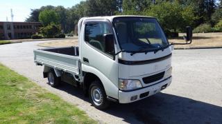 2006 Toyota Toyoace Flat Deck Right Hand Drive, 2 door, manual transmission, Gasoline 4 cylinder engine, air conditioning, power door locks, power windows, power mirrors, white exterior, black interior, cloth. power headlight height adjustment, oem Toyota rubber mats, overhead storage net, foldable middle seat. Measurements Bed length: 9.4 foot and 5.3 foot wide.(All the measurements are deemed to be true but are not guaranteed). $12,370.00 plus $375 processing fee, $12,745.00 total payment obligation before taxes.  Listing report, warranty, contract commitment cancellation fee, financing available on approved credit (some limitations and exceptions may apply). All above specifications and information is considered to be accurate but is not guaranteed and no opinion or advice is given as to whether this item should be purchased. We do not allow test drives due to theft, fraud and acts of vandalism. Instead we provide the following benefits: Complimentary Warranty (with options to extend), Limited Money Back Satisfaction Guarantee on Fully Completed Contracts, Contract Commitment Cancellation, and an Open-Ended Sell-Back Option. Ask seller for details or call 604-522-REPO(7376) to confirm listing availability.