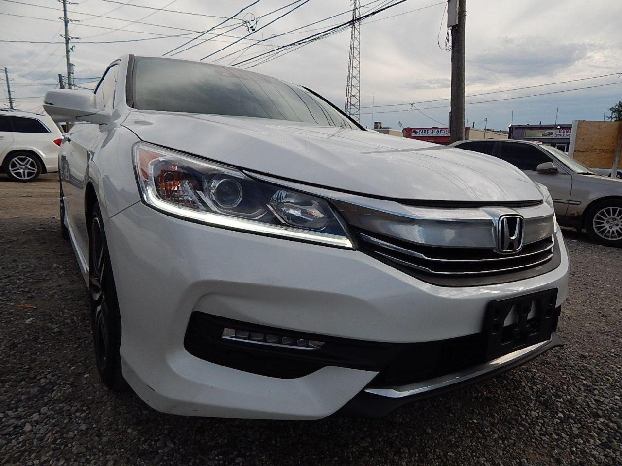 <p>2017 ACCORD SPORTS EDITION WHITE ON BLACK INTERIOR, APPLE CAR PLAY-PUSH BUTTON START-HEATED SEATS-SUN ROOF-BLIND SUPPORT CAMERA-ACTIVE COLLISSION WARNING SYSTEM & LOT MORE COMES CERTIFIED.</p>