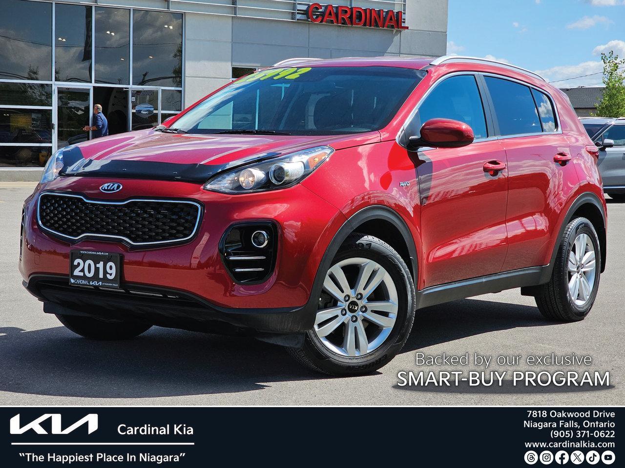 Odometer is 55655 kilometers below market average!



4x4, AWD. 4WD, Front & Rear Brake Service, Fresh Alignment, AWD, 6 Speakers, Air Conditioning, Alloy wheels, AM/FM radio: SiriusXM, Cloth Seat Trim, Driver door bin, Driver vanity mirror, Dual front impact airbags, Exterior Parking Camera Rear, Four wheel independent suspension, Front Bucket Seats, Front reading lights, Fully automatic headlights, Heated Front Bucket Seats, Heated front seats, Illuminated entry, Outside temperature display, Overhead console, Passenger door bin, Passenger vanity mirror, Power door mirrors, Power steering, Power windows, Rear window defroster, Rear window wiper, Remote keyless entry, Split folding rear seat, Steering wheel mounted audio controls, Tachometer, Telescoping steering wheel, Tilt steering wheel, Traction control, Trip computer.



Hyper Red 2019 Kia Sportage LX LX, AWD, Heated Seats, Reverse Camera AWD 6-Speed Automatic with Sportmatic 2.4L I4 DGI DOHC





Awards:

  * JD Power Canada Initial Quality Study (IQS) Reviews:

  * Owners report solid ride comfort, and good outward visibility and performance  especially from turbocharged models. The performance and confidence imparted by the AWD system is highly rated by owners in northern climates, too. Good fuel economy from non-turbo models and built-in storage help round out the package. Source: autoTRADER.ca





Family owned and operated more than 20 years, we provide the friendly and courteous service that you deserve. All of the Pre-Owned vehicles we offer for sale go through a , vigorous safety and mechanical inspection and are thoroughly cleaned and detailed so that they are in as close to as new condition as possible. Our DAILY Ontario wide Price Checks against similar inventory make sure we are offering you the best deal possible on any vehicle in our stock. Read our Online Reviews & Check us out on Facebook!***** See all of our New & Pre-Owned Inventory, at http://www.cardinalkia.com/.***** We have satisfied customers from all over Ontario; Niagara Falls, St. Catharines, Welland, Fonthill, Fort Erie, Grimsby, Port Colborne, Beamsville, Hamilton, Smithville, Wainfleet, Stoney Creek, Hamilton Mountain, Burlington, Oakville, Ancaster and Caledonia, Mississauga, South Brampton and Hagersville.***** With easy bank financing and these great values, you can drive home in one of these great Cardinal Kia pre-owned vehicles today.
