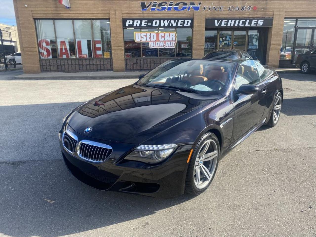 2008 BMW M6 Convertible, A Great Choice for a Performance Convertible !<br><br>GREAT CONDITION, this 2008 BMW M6 comes with a 5 LITRE V10 ENGINE that puts out 500 HORSEPOWER.<br><br>Interior includes: LEATHER HEATED SEATS and a GREAT SOUNDING STEREO SYSTEM.<br><br>Well reviewed:  How does it handle?<br>Remarkably well. The grip generated by the M6 is hugely impressive     it takes real effort to unstick it on dry roads     and it   s fun too,  (carmagazine.co.uk).<br><br> The M6 is a technological tour de force. Few companies have succeeded in translating much Formula One experience and technology to the road but clear parallels can be drawn between BMWs V10 and the engine that once powered the Williams F1 cars. Gerhard Richter, BMW M divisions development chief nails the difference between the M6 and its current rivals.  We are coming from motorsport. Look at our engines; they are high specific output, high revving, normally aspirated. In this combination we are alone,  (rac.co.uk).<br><br>Comes complete with power locks, power windows, and keyless remote entry.<br><br>This car has safety included in the advertised price.<br><br>Please Note: HST and Licensing is an additional fee separate from the advertised price. <br><br>We have a strong confidence in our cars, if you want to have a car inspected, Vision Fine Cars welcomes it.<br>  <br>Certain Crypto-Currency accepted as payment, Charges will apply.<br>