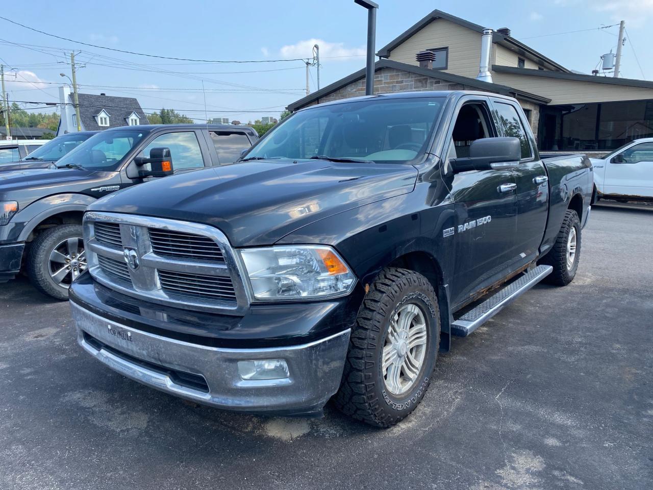 2011 RAM 1500 4WD Quad Cab 140.5" SLT - Photo #1