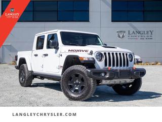 <p><strong><span style=font-family:Arial; font-size:16px;>Jump into the drivers seat and explore the endless possibilities with our amazing selection of vehicles at Langley Chrysler! Immerse yourself in the world of adventure with our brand new, never driven, 2023 Jeep Gladiator Mojave..</span></strong></p> <p><strong><span style=font-family:Arial; font-size:16px;>This striking pickup stands out with its pristine white exterior and sophisticated black interior, a combination designed to turn heads wherever you go..</span></strong> <br> Our Gladiator Mojave is not just a truck, its a powerful statement on wheels.. Under the hood, youll find a robust 3.6L 6-cylinder engine, paired with an 8-speed automatic transmission, that ensures a smooth and powerful drive on any terrain.</p> <p><strong><span style=font-family:Arial; font-size:16px;>But dont just love your car, love buying it! 

The Gladiator Mojave is the epitome of luxury and functionality..</span></strong> <br> It features an array of options such as a state-of-the-art navigation system to guide your way, traction control for a safe and secure drive, and ABS brakes for ultimate safety.. The comfort is unparalleled, with air conditioning, power windows, power steering, and an auto-dimming rearview mirror.</p> <p><strong><span style=font-family:Arial; font-size:16px;>It also includes cutting-edge safety features like dual front impact airbags and electronic stability control..</span></strong> <br> The interior is a marvel of craftsmanship, with a leather steering wheel, premium cloth seats, and a crew cab for added spaciousness.. The rear seats are split folding for those times when you need that extra cargo space.</p> <p><strong><span style=font-family:Arial; font-size:16px;>The Gladiator Mojave also comes with a trailer hitch receiver to haul your gear for those exciting weekend getaways..</span></strong> <br> Now, time for a brain teaser: What has the strength of a Gladiator, the comfort of a luxury sedan, and the versatility of a pickup? The answer is right in front of you - the 2023 Jeep Gladiator Mojave.. At Langley Chrysler, we believe that the process of buying a vehicle should be as enjoyable as driving it.</p> <p><strong><span style=font-family:Arial; font-size:16px;>We invite you to experience the unrivaled performance and exceptional comfort of our brand new Jeep Gladiator Mojave..</span></strong> <br> Dont just love your car, love buying it! 

Step into our dealership today to discover how this truck stands out from the competition.. This is more than just a purchase, its the beginning of a beautiful journey</p>Documentation Fee $968, Finance Placement $628, Safety & Convenience Warranty $699

<p>*All prices are net of all manufacturer incentives and/or rebates and are subject to change by the manufacturer without notice. All prices plus applicable taxes, applicable environmental recovery charges, documentation of $599 and full tank of fuel surcharge of $76 if a full tank is chosen.<br />Other items available that are not included in the above price:<br />Tire & Rim Protection and Key fob insurance starting from $599<br />Service contracts (extended warranties) for up to 7 years and 200,000 kms starting from $599<br />Custom vehicle accessory packages, mudflaps and deflectors, tire and rim packages, lift kits, exhaust kits and tonneau covers, canopies and much more that can be added to your payment at time of purchase<br />Undercoating, rust modules, and full protection packages starting from $199<br />Flexible life, disability and critical illness insurances to protect portions of or the entire length of vehicle loan?im?im<br />Financing Fee of $500 when applicable<br />Prices shown are determined using the largest available rebates and incentives and may not qualify for special APR finance offers. See dealer for details. This is a limited time offer.</p>