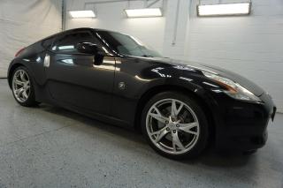 <div>*ACCIDENT FREE*LOCAL ONATRIO CAR*CERTIFIED<span>* </span><span>Very Clean 3.7L V6 Nissan 370Z</span><span> Coupe with Automatic Transmission</span><span> has Bluetooth, Alloys, Cruise Control, Heated Leather Seats. Black on Orange Leather Interior.  FULLY LOADED WITH: Power windows, Power Locks, and Power Heated Mirrors, CD, AC, Alloys, Keyless, Navigation System, Dual Power Front Seats, Cruise Control, Steering </span><span>Mounted Controls, Fog Lights, Heated Leather front Seats, Bluetooth, Push to Start, Paddles </span>Shifters<span>, </span>Premium<span> Bosa </span>Audio<span> System, and ALL THE POWER OPTIONS !!!!!! </span></div><br /><div><span>Vehicle Comes With: Safety Certification, our vehicles qualify up to 4 years extended warranty, please speak to your sales representative for more details.</span><br></div><br /><div><span>Auto Moto Of Ontario @ 583 Main St E. , Milton, L9T3J2 ON. Please call for further details. Nine O Five-281-2255 ALL TRADE INS ARE WELCOMED!<o:p></o:p></span></div><br /><div><span>We are open Monday to Saturdays from 10am to 6pm, Sundays closed.<o:p></o:p></span></div><br /><div><span> <o:p></o:p></span></div><br /><div><a name=_Hlk529556975><span>Find our inventory at  </span></a><a href=http://www/ target=_blank>www</a> <a href=http://www.automotoinc/ target=_blank>automotoinc</a> <a href=http://www.automotoinc.ca/><span>ca</span></a></div>