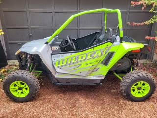<p>Financing Available & Trade-ins Welcome!</p><p>For 2017, the Arctic Cat Wildcat Sport continues to thrill drivers with a 700cc parallel twin-cylinder four stroke engine with four valves per cylinder, routing power though TEAM Rapid Response clutches. The engine puts out over 60 horsepower. These 60-inch wide Cats are capable trail and dune machines. A closed-loop electronic fuel injection system optimizes fuel efficiency and throttle response.</p><p>A performance -engineered chassis handles a wide-range of terrain types, and gets a lot of help from the outstanding suspension options the Sport lineup has. Up front, a double A-Arm setup guides 12.2-inches of travel. On the rear a dual A-Arm, sway bar-equipped design with 12.6 inches of travel handles the rough stuff with 13 in. of rock-clearing ground clearance.</p><p>The big news is the different shock options. The XT EPS comes with JRi ECX-1 gas shocks with high-volume 2.5-in. aluminum bodies and remote reservoirs with 70-position compression adjustability and spring preload adjustability. The Limited EPS runs Elka Stage 5 gas shocks with 2.5-in. aluminum bodies and remote reservoirs. They have low and high speed compression and rebound adjustability as well as spring preload. The Sport SE runs on high performance</p><p>KING gas shocks delivering compression adjustability and precise rebound damping adjustments.</p><p>The Sport also sports a cargo area with 300lbs. of capacity with additional sealed storage under the hood. Need more, there’s a 2-inch receiver hitch and 1,500lbs of towing capacity. The Sports also run on 26-in. Carlisle Trail Pro tires on cast aluminum wheels. The Limited and SE models also get full aluminum half doors. The SE also comes with a 3,000lb Warn winch with synthetic rope in case you get into too much trouble.</p><p> </p>