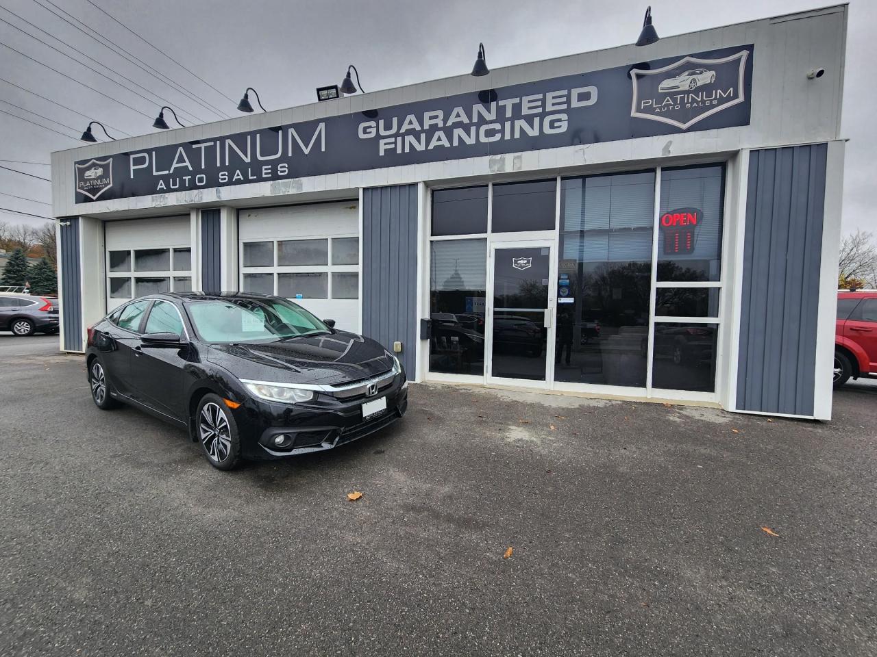 <p>Rev up your style and hit the streets in a ride thats all about fun, sophistication, and a dash of sun-soaked flair. Introducing the 2016 Honda Civic EX-T with a panoramic sunroof thats ready to elevate your driving experience to the next level.</p>

<p>?? Let the Sunshine In: The real star of the show is the massive sunroof that spans the entire length of the cabin. Its like having a piece of the sky right above your head. Whether youre gazing at the stars on a moonlit night or enjoying the warmth of the sun on a lazy Sunday drive, this sunroof will make every moment behind the wheel feel extraordinary.</p>

<p>?? Urban Chic: The 2016 Civic EX-T exudes urban sophistication. Its sleek, aerodynamic design is sure to turn heads, and the spacious interior is a haven of comfort and tech. With features like a touchscreen infotainment system, Bluetooth connectivity, and a rearview camera, youll stay connected and in control.</p>

<p>?? Fuel Efficiency Champion: Worried about fuel costs? Fear not! The 2016 Civic EX-T offers impressive fuel efficiency, so you can spend more time enjoying the ride and less time at the pump. Its the perfect balance of power and economy.</p>

<p>??? Disclaimer: While we strive to provide accurate information, please note that specific features, availability, and pricing may vary. Contact our knowledgeable team for the latest details and to schedule a test drive. So, are you ready to experience the sun-soaked thrill of the 2016 Honda Civic EX-T? ????</p>

<p> Inquire for details @ 613-561-4857 (Call or Text) or Drop by the office @ 2212 Princess St, Kingston, Ontario - Platinum Auto Sales, Proudly Serving Kingston at our New Convenient Location to help serve you better!<br />
 Are you making payments for a vehicle you no longer want or need? We can get you out of that car and into a car you love.<br />
 Have you been to other dealerships and declined for a vehicle? We finance ALL credit situations and income types: Full time, Part time, Pension, Old Age Security, ODSP, Ontario Works, Child Tax and even Cash Income. Good credit, bad credit, no credit? Bankruptcy or Consumer Proposal? Your approved!<br />
 Top Tier Extended Warranty & Gap Insurance Protection Packages! Come see the Platinum team and let us take the stress out of buying your next car.<br />
 Platinum Auto Sales Kingston - Call or Txt 613-561-4857 Come into the office at 2212 Princess St, Kingston The Home of Guaranteed Financing **(O.A.C. and/or down payment may be required).<br />
$699 Certification Fee Includes 30 Day Guarantee, inquire for details.<br />
Below is a generic, mandatory disclosure, only applicable if you opt to purchase as is, When purchasing certified, ignore the following below as we ensure these are quality vehicles which we stand behind.<br />
 If Exercising **OPTION TO BUY VEHICLE AS lS** Option , ( if not Considering as is purchase & prefer to purchase certified, please ignore the following as we have a very thorough certification process & also stand behind our vehicles when certified. )if you opt to Purchase as is, without certification or safety, Please Consider the following,<br />
 This vehicle is being offered to be sold as is, unfit, not e-tested and is not represented as being in road worthy condition, mechanically sound or maintained at any guaranteed level of quality (reminder, This disclosure is only if you opt to purchase as is, ignore all this if you opt to purchase certified). The vehicle may not be fit for use as a means of transportation and may require substantial repairs at the purchasers expense. It may not be possible to register the vehicle to be driven in its current condition. ~ ~ ~ Safety is an additional $699.00 if you would like to purchase it certified. ~ ~ ~<br />
Please contact a sales representative to ensure options are exactly as stated. It is rare but sometimes the vin decoder makes errors<br />
$699 Certification fee includes 30 day guarantee, inquire for details.<br />
</p>