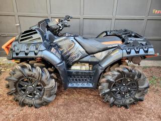 <p>One Owner, Financing Available & Trade-ins Welcome!</p><p>The Sportsman XP 1000 High Lifter Edition delivers the ultimate sport-utility experience, with specially engineered features to dominate the mud. To conquer the mud, a high-performance true on-demand AWD system gives you the traction you need, when you need it. A shielded clutch and engine intake ducting system keeps the mud out and fresh air in.</p><p>An industry-exclusive feature is the rack-mounted radiator up front, which also includes inverted dual fans for cooling. High and low mud-specific transmission gearing is also included, with lower gearing overall.</p><p>This High Lifter Edition comes standard with factory-installed 29.5-inch High Lifter Outlaw 2 tires and high-clearance arched dual A-arm suspension. Stiffer springs help maintain the 13.5 inches of ground clearance through the gnarliest of mud, as do the arched dual A-arms. Even with these features, this High Lifter Edition still retains the massive 1,500 pounds of towing capacity and 290 pounds of payload capacity.</p><p> </p>