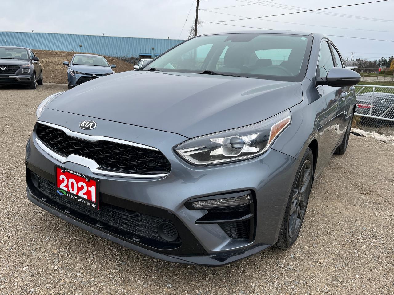 <p>Looking for a stylish and feature-packed sedan? Look no further than this sleek 2021 Kia Forte EX+ from Legacy Auto Credit. This grey beauty boasts a comfortable and spacious interior, perfect for everyday commutes and weekend adventures. With its peppy 4-cylinder engine and smooth CVT transmission, the Forte delivers a smooth and efficient driving experience.</p><p>This well-maintained Forte has only 96,784 km on the odometer, indicating plenty of life left in this reliable vehicle. Enjoy a range of modern conveniences, including heated front seats, a heated steering wheel, and a premium sound system with MP3 capabilities.</p><p>Here are 5 features that make this Forte a standout:</p><ul><li><strong>Heated Front Seats and Steering Wheel:</strong> Stay warm and cozy even on the coldest days.</li><li><strong>Blind Spot Monitor & Lane Keeping Assist:</strong> Drive with confidence knowing you have extra eyes on the road.</li><li><strong>Keyless Entry and Start:</strong> Enjoy the convenience of hassle-free access and ignition.</li><li><strong>Power-Everything:</strong> From windows and locks to mirrors, experience the ease of power-operated conveniences.</li><li><strong>Back-Up Camera:</strong> Navigate tight spaces with ease and added safety.</li></ul><p>Visit Legacy Auto Credit today to see this fantastic 2021 Kia Forte EX+ in person!</p><p> </p>