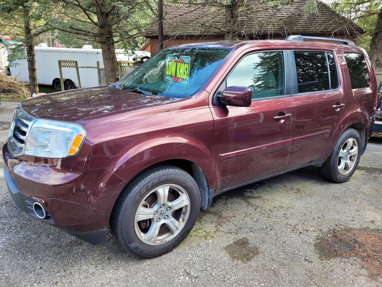 <p>Accident Free, Certified, Financing Available & Trade-ins Welcome!</p><p>Looking for a spacious and reliable SUV with a comfortable interior and a host of features? Look no further than this 2013 Honda Pilot 4WD EX-L at Rockwood Motor Products! This burgundy beauty boasts a sleek exterior and a luxurious grey interior, perfect for families or anyone seeking a versatile vehicle. With 115,000km on the odometer, this Pilot is ready for many more adventures.</p><p>This EX-L trim comes packed with features to enhance your driving experience. From its powerful 3.5L V6 engine to its smooth automatic transmission, youll enjoy a comfortable and confident ride. Step inside and discover the comfort of heated leather seats, a premium sound system, and a sunroof to let in the sunshine. The third-row seating provides ample space for passengers, while the power liftgate makes loading and unloading a breeze.</p><p>Here are 5 features of this Honda Pilot that are sure to impress:</p><ul><li><strong>Heated leather seats:</strong> Stay cozy and comfortable no matter the weather.</li><li><strong>Power liftgate:</strong> Enjoy easy access to your cargo area with the touch of a button.</li><li><strong>Sunroof:</strong> Let the sunshine in and enjoy a panoramic view of the road ahead.</li><li><strong>Third-row seating:</strong> Take the whole family along for the ride with ample passenger space.</li><li><strong>Premium sound system:</strong> Immerse yourself in your favorite music with crystal-clear audio.</li></ul><p>Visit Rockwood Motor Products today to experience this impressive Honda Pilot for yourself!</p><p><em>Powered by AutoIntelligence&trade; AI</em></p>