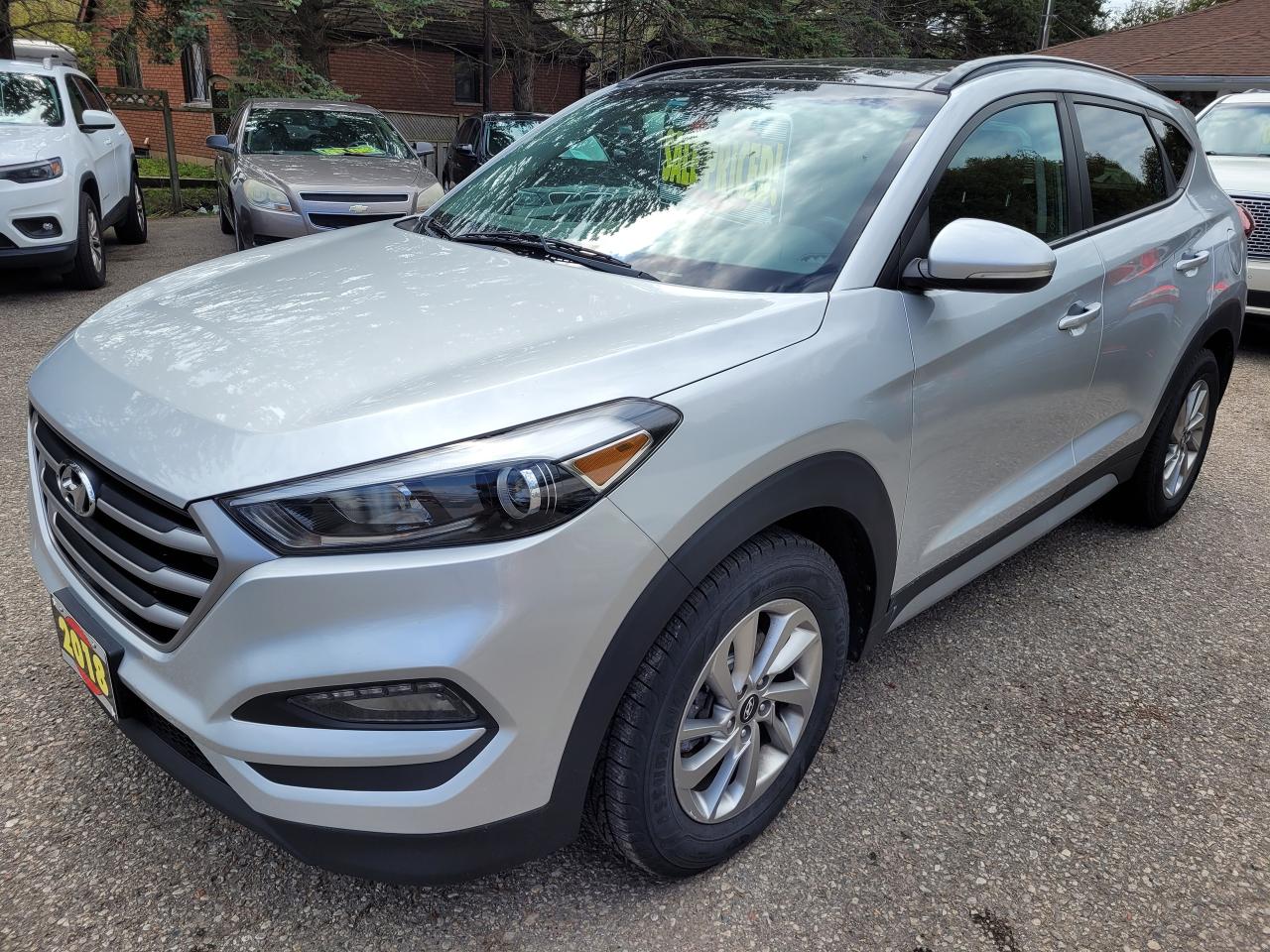 <p>Accident Free, Certified, Financing Available & Trade-ins Welcome  </p><p>New Front & Rear Brake Pads & Rotors</p><p>New GOODYEAR Assurance Weather Ready Tires</p><p>CLIFFORD Remote Starter</p><p>Looking for a reliable and stylish SUV that wont break the bank? Look no further than this 2018 Hyundai Tucson SE, available now at Rockwood Motor Products! With its sleek silver exterior and comfortable black interior, this Tucson is sure to turn heads wherever you go.</p><p>This well-maintained vehicle has a 2.0L I4 engine and boasts a clean Carfax report, ensuring youre driving a vehicle you can trust. Its packed with features designed to make your driving experience comfortable and convenient, including heated front seats, a heated steering wheel, and a sunroof. The Tucson also offers a host of advanced safety features like blind spot monitoring and a rearview camera. With only 156,000km on the odometer, this Tucson is ready for many more adventures!</p><p><strong>Here are 5 features that make this Tucson stand out:</strong></p><ul><li><strong>Heated front seats and steering wheel</strong>: Stay warm and cozy even on the coldest days.</li><li><strong>Sunroof</strong>: Enjoy the fresh air and sunshine while cruising.</li><li><strong>Blind Spot Monitoring</strong>: Drive with confidence knowing youre aware of your surroundings.</li><li><strong>Rearview camera</strong>: Make backing up a breeze and enhance your safety.</li><li><strong>Premium Sound System</strong>: Enjoy your favorite tunes with crystal-clear audio quality.</li></ul><p>Come see this 2018 Hyundai Tucson SE in person at Rockwood Motor Products. We offer financing options and welcome trade-ins.</p><p><em>Powered by AutoIntelligence™ AI</em></p>