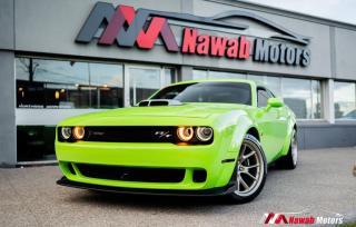 <p>The special-edition 2023 Dodge Challenger R/T Scat Pack Swinger represent the third and fourth of seven special-edition Dodge “Last Call” models and give a nod back to the unique style of the Dodge brand’s “swinging” muscle car lineup of the late 1960s and early 1970s.. The stunning 6.4-liter V8 SRT HEMI engines 450+ horsepower and 460+ pound-feet of torque will leave you speechless. </p>
<p>Some Features :</p>
<p>- Gold school scat pack + bee grille badge</p>
<p>- Gold school bee fender and decklid badge </p>
<p>- Retro swinger rear fender graphics</p>
<p>- Black six-piston Brembo brakes</p>
<p>- Harman Kardon audio system</p>
<p>- Uconnect system</p>
<p>- Heated seats</p>
<p>- Alcantara seats with green stitching</p>
<p>- Smart key</p>
<p>- Dual zone A/C & MUCH MORE!!</p>
<p> </p>
<p> </p><br><p>OPEN 7 DAYS A WEEK. FOR MORE DETAILS PLEASE CONTACT OUR SALES DEPARTMENT</p>
<p>905-874-9494 / 1 833-503-0010 AND BOOK AN APPOINTMENT FOR VIEWING AND TEST DRIVE!!!</p>
<p>BUY WITH CONFIDENCE. ALL VEHICLES COME WITH HISTORY REPORTS. WARRANTIES AVAILABLE. TRADES WELCOME!!!</p>