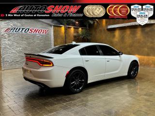 *** <strong>300HP & SUPER TRAK PACK & AWD!! </strong>*** <strong>HEATED & COOLED LEATHER SEATS, HEATED REAR SEATS, HEATED STEERING!!</strong> ***<strong> TOUCHSCREEN NAVIGATION, REMOTE START, APPLE CARPLAY & ANDROID AUTO!!!</strong> *** Heavily optioned and upgraded SXT AWD with the comprehensive<strong> PLUS EQUIPMENT PACKAGE & BLACKTOP PACKAGE</strong> including a full <strong>NAPPA LEATHER INTERIOR</strong>......<strong>A/C VENTILATED SEATS</strong>......Front <strong>HEATED SEATS</strong>......<strong>HEATED REAR SEATS</strong>......Multimedia 8-Inch Touchscreen w/ <strong>APPLE CARPLAY</strong>......<strong>ANDROID AUTO</strong>......<strong>HEATED LEATHER STEERING WHEEL</strong>......Performance Control Pages......<strong>FACTORY REMOTE START</strong>......Dual-Zone Climate Control......LED Headlights......LED Tail Light Bar......<strong>BLACKTOP PACKAGE</strong> (Blackout Grille, Blackout Badging, 20-Inch Black Alloys, & More!!)......<strong>NAVIGATION </strong>Package......Rear View Camera......Auto-Dimming Rear View Mirror......<strong>SUPER TRAK PACK PAGES</strong>......Blind Spot Monitoring......Traction & Stability Control......Hill Start Assist......Sport Mode......Keyless Entry w/ Push Button Start......Parking Sensors......<strong>RAIN-SENSING WIPERS</strong>......Automatic Headlights......<strong>LED FOG LIGHTS</strong>......Premium Mats......<strong>POWER SEATS w/ MEMORY</strong>......Power Tilt/Telescopic Steering Wheel......Power Convenience Package (Windows, Locks Mirrors)......<strong>8-SPEED AUTOMATIC TRANSMISSION</strong>......<strong>POTENT 3.6L 300 HP V6</strong>......<strong>20-INCH BLACKOUT ALLOY WHEELS</strong>.<br /><br />This 2021 Charger AWD comes with all Original Books & Manuals, Two Sets of Key Fobs, Custom Fit Mats, and the balance of<strong> FACTORY DODGE POWERTRAIN WARRANTY</strong>.  Now sale priced at just $34,600 with financing and extended warranty options available!<br /><br />Will accept trades. Please call (204)560-6287 or View at 3165 McGillivray Blvd. (Conveniently located two minutes West from Costco at corner of Kenaston and McGillivray Blvd.)<br /><br />In addition to this please view our complete inventory of used <a href=\https://www.autoshowwinnipeg.com/used-trucks-winnipeg/\>trucks</a>, used <a href=\https://www.autoshowwinnipeg.com/used-cars-winnipeg/\>SUVs</a>, used <a href=\https://www.autoshowwinnipeg.com/used-cars-winnipeg/\>Vans</a>, used <a href=\https://www.autoshowwinnipeg.com/new-used-rvs-winnipeg/\>RVs</a>, and used <a href=\https://www.autoshowwinnipeg.com/used-cars-winnipeg/\>Cars</a> in Winnipeg on our website: <a href=\https://www.autoshowwinnipeg.com/\>WWW.AUTOSHOWWINNIPEG.COM</a><br /><br />Complete comprehensive warranty is available for this vehicle. Please ask for warranty option details. All advertised prices and payments plus taxes (where applicable).<br /><br />Winnipeg, MB - Manitoba Dealer Permit # 4908