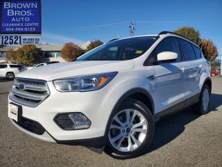 <p>Local, accident free, SE FWD, 1.5L 4 cyl, 6 spd auto, remote entry, heated front seats, bluetooth, backup camera, fog lamps, aluminum wheels and more to enjoy. </p><p><span style=text-decoration: underline;><strong>The 2018 Ford Escape SE FWD has several positive attributes that make it a popular choice for those in the market for a compact SUV. Here are some of the key advantages of this vehicle:</strong></span></p><p>Fuel Efficiency: The 2018 Ford Escape SE FWD is known for its impressive fuel efficiency, thanks to its front-wheel-drive configuration. This makes it a cost-effective option for daily commuting and long road trips.</p><p>Spacious Interior: The Escape offers a comfortable and roomy interior with ample space for both passengers and cargo. The rear seats can be folded down to create additional storage space when needed.</p><p>User-Friendly Technology: This model comes with a user-friendly infotainment system, voice recognition, and smartphone integration.</p><p>The 2018 Ford Escape SE FWD is equipped with a backup camera. This feature contributes to a safer driving experience.</p><p>Smooth Ride: The Escape provides a comfortable and smooth ride, making it a great option for daily commuting and longer journeys. Its suspension system absorbs bumps and road imperfections effectively.</p><p>Versatility: This SUV is versatile and well-suited for a variety of driving conditions, from city streets to mild off-road adventures.</p><p>Reliability: Ford is known for producing durable and reliable vehicles, and the 2018 Escape SE FWD is no exception. Its built to withstand the test of time and maintain its performance over the years.</p><p>Competitive Pricing: The 2018 Ford Escape SE FWD often comes with a competitive price point compared to similar SUVs in its class. This affordability, combined with its features, makes it a good value for the money.</p><p>Overall, the 2018 Ford Escape SE FWD is a well-rounded compact SUV that offers a combination of fuel efficiency, comfort, safety, and versatility, making it an appealing choice for a wide range of drivers.</p><p> </p><p>Please drop by Brown Bros Auto Clearance for a look and a test drive.  Youll be glad you did.  </p><p>Brown Bros Auto Clearance Centre, home of the 30 day exchange policy. We finance when others cant. Easy pricing, easy payments, easy financing. Low finance rates. Cash back or deferred payments available. Visit our website: www.brownbrosautoclearancecentre.com to see our complete inventory of used cars and trucks in Surrey.</p>
