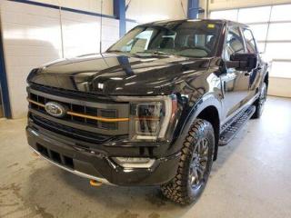 This all new 2023 Ford F-150 Tremor 402A is the highest trimline Tremor available and doesnt it look absolutely stunning in Agate Black Metallic. This truck comes with the ever popular 3.5L EcoBoost engine. This remarkable engine not only produces 400 horsepower and 410 ft pounds of torque, but by leveraging the EcoBoost technology and a 10-speed automatic transmission this truck is rated it to get 13.1 L 100/km (25 miles per gallon) combined highway/city fuel economy. This 4-wheel drive truck also has an 10,900 lbs. towing capacity.

Key Features:
Twin Panel Moonroof 
Power Tailgate 
Tailgate Step
12 Center-Stack LCD Screen
8 Productivity Screen in Instrument Cluster
Heated Front & Rear Seats
Heated Steering Wheel
18 Dark Matte Finish Alloy Wheels
360 Degree Camera
LED Projector Beam Headlamps
Power Tilt/Telescopic Steering Wheel W/Memory
Remote Start
Intelligent Cruise Control
Box link Cargo Management System W/Locking Cleats 
Apple Car Play/Android Auto 
FordPass Connect 
Dual-Zone Automatic Climate Control W/Automatic Temperature Control
4G Wi-Fi Modem
Universal Garage Door Opener 
10-Way Power Drivers Seat & Multi-Adjustable Passenger Seat
Automatic High Beam 
Wireless Charging pad
Reverse Brake Assist  
Lane Keeping System 
BLIS Pre-Collision Assist
Rain-Sensing Wipers
4X4

Saskatchewan has a rough climate, but the F150 Tremor is designed to shine out here. It leverages physical features and technology that will keep you comfortable and safe. This truck is loaded right up and includes 18 dark matte alloy wheels, 8 productivity screen in instrument cluster, BLIS w/trailer tow coverage,  rear under seat storage, AdvanceTrac with roll stability control, class 4 hitch w/4 & 7 pin wiring,  10-way power drivers seat, ambient lightning, wireless phone charging pad, power tilt/telescopic steering column with memory, power sliding rear window, intelligent cruise control, B&O sound system (8 speakers and a subwoofer), Ford Pass, Bluetooth,  lane-keeping alert, lane-keeping aid, dual-zone automatic climate control,  onboard 400W outlet, reverse brake assist, pre-collision braking, BLIS (blind spot information system), power adjustable pedals, remote start, remote tailgate release, remote start, automatic headlights, automatic high beam, reverse sensing system, LED fog lamps, lane keeping assist, rear view camera, post collision braking, trailer sway control, power tailgate lock, unique tremor control arms, unique tremor front knuckles, unique tremor style step bars, unique tremor box decals, 136L fuel tank, 3.73 locking rear axle, 9.75 gearset, electronic ten speed transmission and so much more. 

At Moose Jaw Ford, we're driving change all across Saskatchewan! We are Moose Jaw's prime destination for everything automotive. We pride ourselves by consistently providing the highest quality customer experience  every single time. Because of this commitment, and the love of what we do, Moose Jaw Ford is the recipient of multiple President's Club Awards and is recognized as one of Canada's Best Managed Companies. We are dedicated to building long lasting relationships. You can trust that our trained service technicians will take excellent care of you and your vehicle when you visit our service department. Come visit us today at 1010 North Service Road..