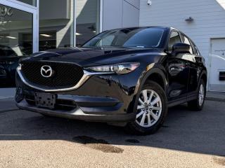 Get set for an adventure with our 2018 Mazda CX-5 GS that takes the stage in Jet Black Mica! Its powered by a 2.5 Liter 4 Cylinder that produces 187 horsepower while paired to a 6-Speed Automatic transmission.Its absolutely dazzling with alloy wheels, rear roof spoiler, and dual exhaust.Slide inside our GS cabinto find a world of comfort and convenience withsupportive leatherette seats that have lux suede inserts, heated front seats, a leather-wrapped heated steering wheel with mounted audio/cruise controls, and a power sunroof. It also has dual-zone climate control, Mazda Connect infotainment, a multi-function commander control, AM/FM/HD audio, and Bluetooth.Space is abundant for both cargo and passengers with 60/40 split fold-down rear seats and plenty of room for 5.Youll drive confidently knowing our Mazda has a variety of safety features including a backup camera, blindspot monitoring, 4-Wheel anti-locking braking system, LED headlights, stability/traction control, and advanced airbags. Refined, modern, highly functional and highly desirable, this CX-5 GS is practically calling your name! Print this page and call us Now... We Know You Will Enjoy Your Test Drive Towards Ownership!Go Mazda is an AMVIC licensed business.Please note: this vehicle was previously registered in the province ofOntario