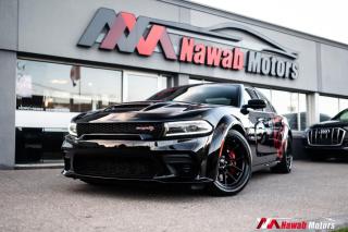 <p>The 2022 Dodge Charger Widebody Hellcat Redeye is a high-performance sedan that packs a powerful punch under the hood. With a supercharged 6.2-liter V8 engine producing 780+ horsepower, this car can go from 0 to 60 mph in less than 3.8 seconds. Its wider stance, upgraded brakes, and other performance enhancements make it an impressive choice for those seeking a thrilling driving experience.</p>
<p>Some Features Included:</p>
<p>- Widebody </p>
<p>- Brembo brakes</p>
<p>- Leather heated seats</p>
<p>- Multifunctional leather steering wheel</p>
<p>- Heated steering</p>
<p>- Uconnect</p>
<p>- Alpine sound system</p>
<p>- SRT mode</p>
<p>- Launch Control</p>
<p>- Rear spoiler</p>
<p>- Blind spot assist</p>
<p>- Alloys & Much More!!</p>
<p> </p><br><p>OPEN 7 DAYS A WEEK. FOR MORE DETAILS PLEASE CONTACT OUR SALES DEPARTMENT</p>
<p>905-874-9494 / 1 833-503-0010 AND BOOK AN APPOINTMENT FOR VIEWING AND TEST DRIVE!!!</p>
<p>BUY WITH CONFIDENCE. ALL VEHICLES COME WITH HISTORY REPORTS. WARRANTIES AVAILABLE. TRADES WELCOME!!!</p>