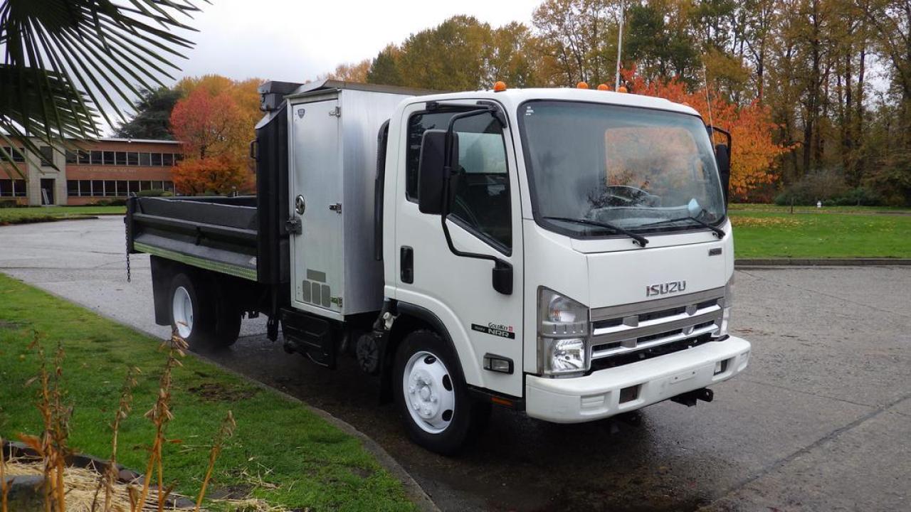 2015 Isuzu NQR Dump Truck 3 Seater Diesel, 5.2L L6 DIESEL engine, 6 cylinder, 2 door, automatic, 4X2, cruise control, air conditioning, AM/FM radio, power door locks, power windows, power mirrors, white exterior, black interior, cloth. Dump Box size is 11 Foot Long, 7 Foot Wide. Certificate and Decal Valid to November 2024 $64,710.00 plus $375 processing fee, $65,085.00 total payment obligation before taxes.  Listing report, warranty, contract commitment cancellation fee, financing available on approved credit (some limitations and exceptions may apply). All above specifications and information is considered to be accurate but is not guaranteed and no opinion or advice is given as to whether this item should be purchased. We do not allow test drives due to theft, fraud and acts of vandalism. Instead we provide the following benefits: Complimentary Warranty (with options to extend), Limited Money Back Satisfaction Guarantee on Fully Completed Contracts, Contract Commitment Cancellation, and an Open-Ended Sell-Back Option. Ask seller for details or call 604-522-REPO(7376) to confirm listing availability.