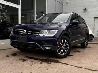 Our inviting 2021 Volkswagen Tiguan Comfortline is shown off in Atlantic Blue Metallic! Its powered by a Turbocharged 2.0 Liter 4 Cylinder engine that produces 184 horsepower while paired with a 6-Speed Automatic transmission.Its absolutely stunning with alloy wheels, LED headlights, roof rails, and rear roof spoiler.Inside our Comfortline, open the door to find black leather seating, heated front seats, a leather-wrapped steering wheel with mounted audio/cruise controls, and a panoramic sunroof. Its also equipped with navigation, dual-zone climate control, an AM/FM radio thats XM radio ready, and an impressive 6 speaker sound system.OurVolkswagen will give you peace of mind with an array of safety features inlcuding a backup camera, 4-Wheel anti-locking braking system, a tire pressure monitoring system, stability/traction control, a fleet of airbags and more!Print this page and call us Now... We Know You Will Enjoy Your Test Drive Towards Ownership! We look forward to showing you why Go Mazda is the best place for all your automotive needs.Go Mazda is an AMVIC licensed business.Please note: this vehicle was previously registered in the province of British Columbia and was previously used as Fleet.