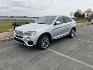 The 2016 BMW X4 xDrive28i is a remarkable blend of style, performance, and luxury, making it a standout choice in the compact luxury crossover segment. From its distinctive exterior design to its well-crafted interior, this vehicle exudes a sense of sophistication that is sure to turn heads on the road.One of the key highlights of the X4 xDrive28i is its powerful and efficient engine. The 2.0-liter turbocharged four-cylinder engine delivers an impressive balance of performance and fuel efficiency. With 240 horsepower and 258 lb-ft of torque, the X4 accelerates smoothly and confidently, providing a thrilling driving experience without compromising on fuel economy.The xDrive all-wheel-drive system further enhances the vehicles handling and traction, ensuring a secure and enjoyable ride in various driving conditions. Whether navigating city streets or tackling winding mountain roads, the X4 xDrive28i excels in delivering a responsive and engaging driving experience that is synonymous with the BMW brand.Inside the cabin, BMWs commitment to luxury and craftsmanship is evident. High-quality materials, elegant design elements, and attention to detail create a refined and comfortable interior. The supportive and well-contoured seats, along with a host of advanced technology features, contribute to a driving environment that is both inviting and user-friendly.The X4 xDrive28i also stands out in terms of practicality. Despite its coupe-like roofline, the vehicle offers a surprising amount of cargo space, making it a versatile choice for daily commuting or weekend getaways. The power liftgate adds convenience, and the flexible rear seat configuration further enhances the overall utility of the vehicle.In terms of safety, the X4 xDrive28i comes equipped with a comprehensive array of advanced safety features, including airbags, stability control, and a suite of driver assistance technologies. These features not only provide peace of mind but also contribute to the vehicles overall safety performance.In conclusion, the 2016 BMW X4 xDrive28i is a compelling choice for drivers seeking a combination of sporty performance, luxurious comfort, and practical versatility. With its eye-catching design, powerful engine, and well-appointed interior, this BMW model delivers a driving experience that is sure to satisfy even the most discerning enthusiasts in the luxury crossover market.