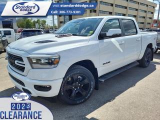 <b>Leather Seats, 5.7L V8 HEMI MDS VVT eTorque Engine, Trailer Hitch!</b><br> <br> <br> <br>  Whether you need tough and rugged capability, or soft and comfortable luxury, this 2023 Ram delivers every time. <br> <br>The Ram 1500s unmatched luxury transcends traditional pickups without compromising its capability. Loaded with best-in-class features, its easy to see why the Ram 1500 is so popular. With the most towing and hauling capability in a Ram 1500, as well as improved efficiency and exceptional capability, this truck has the grit to take on any task.<br> <br> This bright white Crew Cab 4X4 pickup   has a 8 speed automatic transmission and is powered by a  395HP 5.7L 8 Cylinder Engine.<br> <br> Our 1500s trim level is Sport. This RAM 1500 Sport throws in some great comforts such as power-adjustable heated front seats with lumbar support, dual-zone climate control, power-adjustable pedals, deluxe sound insulation, and a heated leather-wrapped steering wheel. Connectivity is handled by an upgraded 12-inch display powered by Uconnect 5W with inbuilt navigation, mobile internet hotspot access, smart device integration, and a 10-speaker audio setup. Additional features include power folding exterior mirrors, a power rear window with defrosting, a trailer wiring harness, heavy-duty suspension, cargo box lighting, and a locking tailgate. This vehicle has been upgraded with the following features: Leather Seats, 5.7l V8 Hemi Mds Vvt Etorque Engine, Trailer Hitch. <br><br> View the original window sticker for this vehicle with this url <b><a href=http://www.chrysler.com/hostd/windowsticker/getWindowStickerPdf.do?vin=1C6SRFVT6PN632302 target=_blank>http://www.chrysler.com/hostd/windowsticker/getWindowStickerPdf.do?vin=1C6SRFVT6PN632302</a></b>.<br> <br>To apply right now for financing use this link : <a href=https://standarddodge.ca/financing target=_blank>https://standarddodge.ca/financing</a><br><br> <br/><br>* Visit Us Today *Youve earned this - stop by Standard Chrysler Dodge Jeep Ram located at 208 Cheadle St W., Swift Current, SK S9H0B5 to make this car yours today! <br> Pricing may not reflect additional accessories that have been added to the advertised vehicle<br><br> Come by and check out our fleet of 30+ used cars and trucks and 120+ new cars and trucks for sale in Swift Current.  o~o