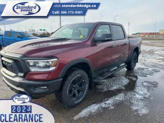 <b>Off-Road Suspension,  SiriusXM,  Apple CarPlay,  Android Auto,  Navigation!</b><br> <br> <br> <br>  Whether you need tough and rugged capability, or soft and comfortable luxury, this 2023 Ram delivers every time. <br> <br>The Ram 1500s unmatched luxury transcends traditional pickups without compromising its capability. Loaded with best-in-class features, its easy to see why the Ram 1500 is so popular. With the most towing and hauling capability in a Ram 1500, as well as improved efficiency and exceptional capability, this truck has the grit to take on any task.<br> <br> This red pearl Crew Cab 4X4 pickup   has a 8 speed automatic transmission and is powered by a  395HP 5.7L 8 Cylinder Engine.<br> <br> Our 1500s trim level is Rebel. Bold and unapologetic, this Ram 1500 Rebel features beefy off-road suspension including Bilstein dampers, skid plates for underbody protection, gloss black wheels, front fog lamps, power-folding exterior mirrors with courtesy lamps, and black fender flares, with front bumper tow hooks. The standard features continue, with power-adjustable heated front seats with lumbar support, dual-zone climate control, power-adjustable pedals, deluxe sound insulation, and a leather-wrapped steering wheel. Connectivity is handled by an upgraded 8.4-inch display powered by Uconnect 5 with inbuilt navigation, mobile internet hotspot access, Apple CarPlay, Android Auto and SiriusXM streaming radio. Additional features include a power rear window with defrosting, class II towing equipment including a hitch, wiring harness and trailer sway control, heavy-duty suspension, cargo box lighting, and a locking tailgate. This vehicle has been upgraded with the following features: Off-road Suspension,  Siriusxm,  Apple Carplay,  Android Auto,  Navigation,  Heated Seats,  4g Wi-fi. <br><br> View the original window sticker for this vehicle with this url <b><a href=http://www.chrysler.com/hostd/windowsticker/getWindowStickerPdf.do?vin=1C6SRFLT1PN692877 target=_blank>http://www.chrysler.com/hostd/windowsticker/getWindowStickerPdf.do?vin=1C6SRFLT1PN692877</a></b>.<br> <br>To apply right now for financing use this link : <a href=https://standarddodge.ca/financing target=_blank>https://standarddodge.ca/financing</a><br><br> <br/><br>* Visit Us Today *Youve earned this - stop by Standard Chrysler Dodge Jeep Ram located at 208 Cheadle St W., Swift Current, SK S9H0B5 to make this car yours today! <br> Pricing may not reflect additional accessories that have been added to the advertised vehicle<br><br> Come by and check out our fleet of 30+ used cars and trucks and 120+ new cars and trucks for sale in Swift Current.  o~o