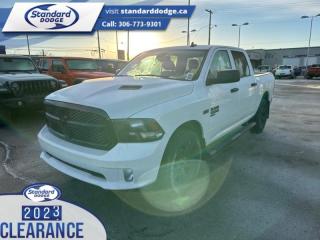<b>Express Value Package, Sub Zero Package, Mopar Sport Performance Hood, Trailer Hitch!</b><br> <br> <br> <br>  Get the job done right with this rugged Ram 1500 Classic pickup. <br> <br>The reasons why this Ram 1500 Classic stands above its well-respected competition are evident: uncompromising capability, proven commitment to safety and security, and state-of-the-art technology. From its muscular exterior to the well-trimmed interior, this 2023 Ram 1500 Classic is more than just a workhorse. Get the job done in comfort and style while getting a great value with this amazing full-size truck. <br> <br> This bright white Crew Cab 4X4 pickup   has a 8 speed automatic transmission and is powered by a  395HP 5.7L 8 Cylinder Engine.<br> <br> Our 1500 Classics trim level is Express. This Ram 1500 Express features upgraded aluminum wheels, front fog lamps and USB connectivity, along with a great selection of standard features such as class II towing equipment including a hitch, wiring harness and trailer sway control, heavy-duty suspension, cargo box lighting, and a locking tailgate. Additional features include heated and power adjustable side mirrors, UCconnect 3, cruise control, air conditioning, vinyl floor lining, and a rearview camera. This vehicle has been upgraded with the following features: Express Value Package, Sub Zero Package, Mopar Sport Performance Hood, Trailer Hitch. <br><br> View the original window sticker for this vehicle with this url <b><a href=http://www.chrysler.com/hostd/windowsticker/getWindowStickerPdf.do?vin=3C6RR7KT5PG667933 target=_blank>http://www.chrysler.com/hostd/windowsticker/getWindowStickerPdf.do?vin=3C6RR7KT5PG667933</a></b>.<br> <br>To apply right now for financing use this link : <a href=https://standarddodge.ca/financing target=_blank>https://standarddodge.ca/financing</a><br><br> <br/><br>* Visit Us Today *Youve earned this - stop by Standard Chrysler Dodge Jeep Ram located at 208 Cheadle St W., Swift Current, SK S9H0B5 to make this car yours today! <br> Pricing may not reflect additional accessories that have been added to the advertised vehicle<br><br> Come by and check out our fleet of 30+ used cars and trucks and 120+ new cars and trucks for sale in Swift Current.  o~o