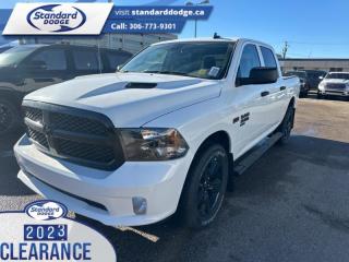 <b>Express Value Package, Sub Zero Package, Mopar Sport Performance Hood, Trailer Hitch!</b><br> <br> <br> <br>  This Ram 1500 Classic is a top contender in the full-size pickup segment thanks to a winning combination of a strong powertrain, a smooth ride and a well-trimmed cabin. <br> <br>The reasons why this Ram 1500 Classic stands above its well-respected competition are evident: uncompromising capability, proven commitment to safety and security, and state-of-the-art technology. From its muscular exterior to the well-trimmed interior, this 2023 Ram 1500 Classic is more than just a workhorse. Get the job done in comfort and style while getting a great value with this amazing full-size truck. <br> <br> This bright white Crew Cab 4X4 pickup   has a 8 speed automatic transmission and is powered by a  395HP 5.7L 8 Cylinder Engine.<br> <br> Our 1500 Classics trim level is Express. This Ram 1500 Express features upgraded aluminum wheels, front fog lamps and USB connectivity, along with a great selection of standard features such as class II towing equipment including a hitch, wiring harness and trailer sway control, heavy-duty suspension, cargo box lighting, and a locking tailgate. Additional features include heated and power adjustable side mirrors, UCconnect 3, cruise control, air conditioning, vinyl floor lining, and a rearview camera. This vehicle has been upgraded with the following features: Express Value Package, Sub Zero Package, Mopar Sport Performance Hood, Trailer Hitch. <br><br> View the original window sticker for this vehicle with this url <b><a href=http://www.chrysler.com/hostd/windowsticker/getWindowStickerPdf.do?vin=3C6RR7KT7PG667934 target=_blank>http://www.chrysler.com/hostd/windowsticker/getWindowStickerPdf.do?vin=3C6RR7KT7PG667934</a></b>.<br> <br>To apply right now for financing use this link : <a href=https://standarddodge.ca/financing target=_blank>https://standarddodge.ca/financing</a><br><br> <br/><br>* Visit Us Today *Youve earned this - stop by Standard Chrysler Dodge Jeep Ram located at 208 Cheadle St W., Swift Current, SK S9H0B5 to make this car yours today! <br> Pricing may not reflect additional accessories that have been added to the advertised vehicle<br><br> Come by and check out our fleet of 30+ used cars and trucks and 120+ new cars and trucks for sale in Swift Current.  o~o
