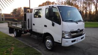 2019 Hino 195 Flat Deck Dually Diesel, Hino J05E-TP 5.1L I4 210hp 440ft. lbs, 4 cylinder, 4 door, automatic, cruise control, air conditioning, AM/FM radio, CD player, exhaust brake, window locks, overdrive folding middle seat, armrest, air drivers seat, ratchet straps, side steps, cargo cover with reel, work lights, folding flat decks sides, tow hitch receiver, trailer brake controller, back up camera, power door locks, power windows, power mirrors, white exterior, grey interior, cloth. Measurements: 11.5 foot long, 8 foot wide.(All the measurements are deemed to be true but are not guaranteed). Certification and decal valid until 2024 March. $38,820.00 plus $375 processing fee, $39,195.00 total payment obligation before taxes.  Listing report, warranty, contract commitment cancellation fee, financing available on approved credit (some limitations and exceptions may apply). All above specifications and information is considered to be accurate but is not guaranteed and no opinion or advice is given as to whether this item should be purchased. We do not allow test drives due to theft, fraud and acts of vandalism. Instead we provide the following benefits: Complimentary Warranty (with options to extend), Limited Money Back Satisfaction Guarantee on Fully Completed Contracts, Contract Commitment Cancellation, and an Open-Ended Sell-Back Option. Ask seller for details or call 604-522-REPO(7376) to confirm listing availability.