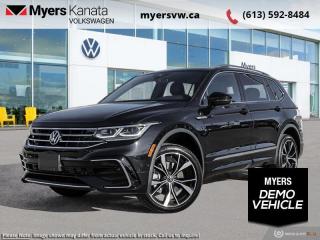 <b>Leather Seats!</b><br> <br> <br> <br>  Everything from capacity, capability, comfort, and ease of use was designed with relentless purpose on this 2023 Tiguan. <br> <br>Whether its a weekend warrior or the daily driver this time, this 2024 Tiguan makes every experience easier to manage. Cutting edge tech, both inside the cabin and under the hood, allow for safe, comfy, and connected rides that keep the whole party going. The crossover of the future is already here, and its called the Tiguan.<br> <br> This deep black pearl SUV  has an automatic transmission and is powered by a  2.0L I4 16V GDI DOHC Turbo engine.<br> <br> Our Tiguans trim level is Highline R-Line. This range-topping Tiguan Highline R-Line is fully-loaded with ventilated and heated leather-wrapped seats with power adjustment, lumbar support and memory function, a heated leather-wrapped steering wheel, an 8-speaker Fender audio system with a subwoofer, adaptive cruise control, a 360-camera with aerial view, park distance control with automated parking sensors, and remote engine start. Additional features include an express open/close sunroof with tilt and slide functions and a power sunshade, rain detecting wipers with heated jets, a power liftgate, 4G LTE mobile hotspot internet access, and an 8-inch infotainment screen with satellite navigation, wireless Apple CarPlay and Android Auto, and SiriusXM streaming radio. Safety features also include blind spot detection, lane keep assist, lane departure warning, VW Car-Net Safe & Secure, forward and rear collision mitigation, and autonomous emergency braking. This vehicle has been upgraded with the following features: Leather Seats.  This is a demonstrator vehicle driven by a member of our staff and has just 5050 kms.<br><br> <br>To apply right now for financing use this link : <a href=https://www.myersvw.ca/en/form/new/financing-request-step-1/44 target=_blank>https://www.myersvw.ca/en/form/new/financing-request-step-1/44</a><br><br> <br/>    4.99% financing for 84 months. <br> Buy this vehicle now for the lowest bi-weekly payment of <b>$373.59</b> with $0 down for 84 months @ 4.99% APR O.A.C. ( taxes included, $1071 (OMVIC fee, Air and Tire Tax, Wheel Locks, Admin fee, Security and Etching) is included in the purchase price.    ).  Incentives expire 2024-05-31.  See dealer for details. <br> <br> <br>LEASING:<br><br>Estimated Lease Payment: $284 bi-weekly <br>Payment based on 3.99% lease financing for 48 months with $0 down payment on approved credit. Total obligation $29,579. Mileage allowance of 16,000 KM/year. Offer expires 2024-05-31.<br><br><br>Call one of our experienced Sales Representatives today and book your very own test drive! Why buy from us? Move with the Myers Automotive Group since 1942! We take all trade-ins - Appraisers on site!<br> Come by and check out our fleet of 40+ used cars and trucks and 120+ new cars and trucks for sale in Kanata.  o~o