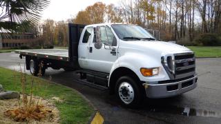 2008 Ford F-650 20 Foot Flat Deck SuperCab 2WD 5.9L Cummins L6 DIESEL engine, Hydraulic Brakes, automatic, 4X2, cruise control, air conditioning, AM/FM radio, CD player, power door locks, power windows, white exterior, grey interior, cloth.  Deck size: 20.5 Feet by 8.5 Feet. Certification and Decal valid until November 2024. Measurements: height of the deck 45 inches, front of the truck to the back of the cab 134 inches, $44,810.00 plus $375 processing fee, $45,185.00 total payment obligation before taxes.  Listing report, warranty, contract commitment cancellation fee, financing available on approved credit (some limitations and exceptions may apply). All above specifications and information is considered to be accurate but is not guaranteed and no opinion or advice is given as to whether this item should be purchased. We do not allow test drives due to theft, fraud and acts of vandalism. Instead we provide the following benefits: Complimentary Warranty (with options to extend), Limited Money Back Satisfaction Guarantee on Fully Completed Contracts, Contract Commitment Cancellation, and an Open-Ended Sell-Back Option. Ask seller for details or call 604-522-REPO(7376) to confirm listing availability.