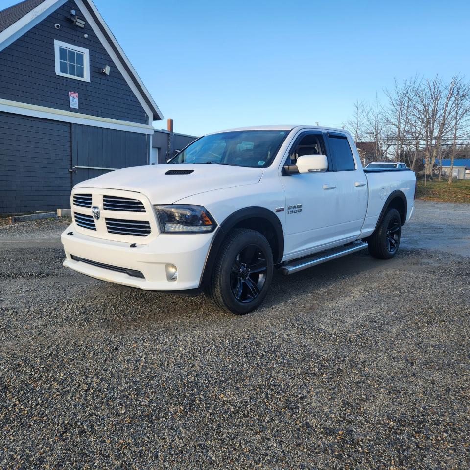 Used 2015 RAM 1500 4WD QUAD CAB 140.5