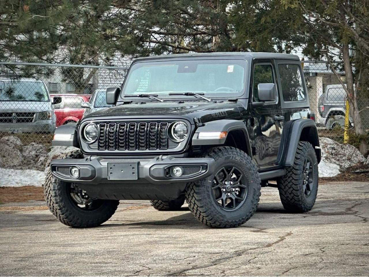 Ready to go wild, our New 2024 Jeep Wrangler Willys 4 Door 4X4 with the Convenience Pack is built for unbound adventure in Black! Motivated by a TurboCharged 2.0 Litre 4 Cylinder serving up 270hp matched to an 8 Speed Automatic transmission for trail-friendly strength. This Four Wheel Drive SUV also boasts Dana axles and a locking rear differential for leaving the pavement behind, and it achieves approximately 11.2L/100km on the highway. LED lighting, fog lamps, exclusive graphics, black alloy wheels, rock rails, a black grille, skid plates, and a body-color sport bar bring out the bold side of our Wrangler.  Our Willys cabin has a smart layout with our Convenience Pack. It adds heated cloth front seats, a heated-wrapped steering wheel, automatic climate control, a 7-inch driver display, remote start, and WiFi compatibility for enhanced comfort and convenience. Standard highlights include 12V power outlets, keyless access, cruise control, and a 12.3-inch touchscreen that supports Apple CarPlay®, Android Auto®, Bluetooth®, an eight-speaker audio system, and Off-Road Info Pages. Now pack up and pursue your dreams!  Jeep supplies key features for your safety, like a rearview camera, stability/traction control, hill-start assist, trailer-sway damping, tire-pressure monitoring, advanced airbags, ABS, and more. With benefits like those, our Wrangler Willys is an excellent choice for overcoming your next challenge! Save this Page and Call for Availability. We Know You Will Enjoy Your Test Drive Towards Ownership!