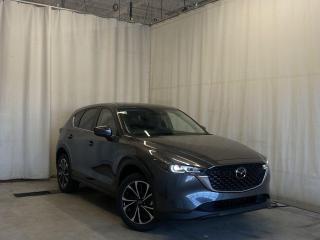 <p>NEW 2024 CX-5 GS Comfort AWD. Bluetooth, Skyactiv-G 2.5 L (Inline-4). Backup Cam, Available NAV, Leatherette/Suede Heated Seats, Advanced Keyless Remote Entry, Tilt/Sliding Moonroof, Power Trunk, Adaptive Cruise Control, Heated Steering Wheel, Wiper Blade De-Icer, Auto Dual-Zone Climate Control, Rear Air Vents, Auto Rain-Sensing Wipers, Electronic Parking Brake, 19 Machine Spokes Polished Finish Alloy Wheels</p>  <p>Includes New Car Package (3M Hood/Fenders/Mirrors, All Weather Mats, Cargo Tray)</p> <p>Includes Protection Package (Undercoating, Paint Sealant, Rustproofing, Interior Protection)</p>  <p>Includes:</p> <p>i-ACTIVSENSE + Safety Features (Smart City Brake Support-Front, Rear Cross Traffic Alert, Mazda Radar Cruise Control With Stop & Go, Distance Recognition Support System, Lane-Keep Assist System, Lane Departure Warning System, Advanced Blind Spot Monitoring)</p>  <p>Comfort Package Includes: Power glass moonroof with interior sunshade, tilt-up ventilation and one-touch open feature, Advanced Keyless Entry, Rear passenger vents (back of centre console), Automatic dual-zone climate controls</p>  <p>A joy to drive, our 2024 Mazda CX-5 GS Comfort AWD radiates refined style in Machine Grey Metallic! Motivated by a 2.5 Liter 4 Cylinder that delivers 187hp tethered to a paddle-shifted 6 Speed Automatic transmission. You can put that strength to good use with the added traction of torque vectoring, and this All Wheel Drive SUV returns nearly approximately 7.8L/100km on the highway. Our CX-5 also has an expressive design with bold details like 19-inch alloy wheels, a rear roof spoiler, and bright-tipped dual exhaust outlets.</p>  <p>Our GS Comfort cabin is no ordinary interior. Its tailor-made for better travel with heated leatherette/suede power front seats, a leather-wrapped steering wheel, automatic climate control, pushbutton ignition, and keyless access. Mazda makes connecting easy by providing a 10.25-inch central display, a multifunction Commander controller, Apple CarPlay/Android Auto, Bluetooth, voice control, and six-speaker audio. The versatile rear cargo space adds adventure-friendly functionality.</p>  <p>Safety is a high priority for Mazda, which helps protect you and your loved ones with automatic emergency braking, adaptive cruise control, a rearview camera, lane-keeping assistance, blind-spot monitoring, and other intelligent technologies. With all that, our CX-5 GS Comfort is here to transcend the ordinary! Save this page, Come in for a Qualified Test Drive. We Know You Will Enjoy Your Test Drive Towards Ownership!</p>  <p>Call 587-409-5859 for more info or to schedule an appointment! Listed Pricing is valid for 72 hours. Financing is available, please see dealer for term availability and interest rates. AMVIC Licensed Business.</p>