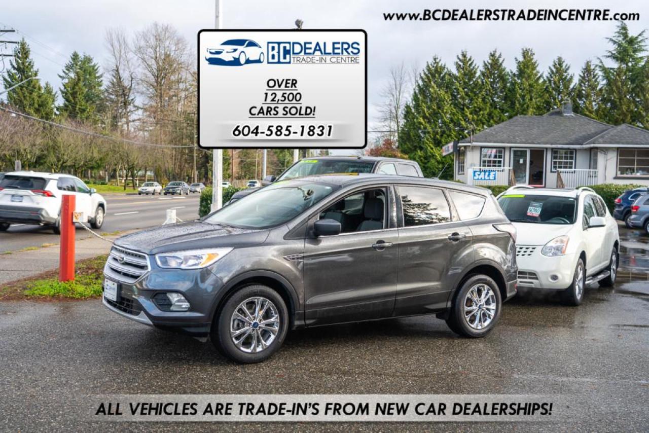 <div class=form-group>                                            <p>Local BC 4x4 Ford Escape SE well equipped with Bluetooth, Backup Cam with large factory touch screen, all of the power options, alloy wheels and more.</p>                                        </div>                                        <br>                                        <div class=form-group>                                            <p>                                                </p><p>Excellent, Affordable Lubrico Warranty Options Available on ALL Vehicles!</p><p>604-585-1831</p><p>All Vehicles are Safety Inspected by a 3rd Party Inspection Service. <br> <br>We speak English, French, German, Punjabi, Hindi and Urdu Language! </p><p><br>We are proud to have sold over 14,500 vehicles to our customers throughout B.C.<br> <br>What Makes Us Different? <br>All of our vehicles have been sent to us from new car dealerships. They are all trade-ins and we are a large remarketing centre for the lower mainland new car dealerships. We do not purchase vehicles at auctions or from private sales. <br> <br>Administration Fee of $375<br> <br>Disclaimer: <br>Vehicle options are inputted from a VIN decoder. As we make our best effort to ensure all details are accurate we can not guarantee the information that is decoded from the VIN. Please verify any options before purchasing the vehicle. <br> <br>B.C. Dealers Trade-In Centre <br>14458 104th Ave. <br>Surrey, BC <br>V3R1L9 <br>DL# 26220 <br> <br>(604) 585-1831</p>                                            <p></p>                                        </div>                                     <p><br></p><p>Excellent, Affordable Lubrico Warranty Options Available on ALL Vehicles!</p><p><span style=background-color: rgba(var(--bs-white-rgb),var(--bs-bg-opacity)); color: var(--bs-body-color); font-family: open-sans, -apple-system, BlinkMacSystemFont, "Segoe UI", Roboto, Oxygen, Ubuntu, Cantarell, "Fira Sans", "Droid Sans", "Helvetica Neue", sans-serif; font-size: var(--bs-body-font-size); font-weight: var(--bs-body-font-weight); text-align: var(--bs-body-text-align);>All Vehicles are Safety Inspected by a 3rd Party Inspection Service. </span><br><br>We speak English, French, German, Punjabi, Hindi and Urdu Language! </p><p><br>We are proud to have sold over 14,500 vehicles to our customers throughout B.C. </p><p><br>What Makes Us Different? <br>All of our vehicles have been sent to us from new car dealerships. They are all trade-ins and we are a large remarketing centre for the lower mainland new car dealerships. We do not purchase vehicles at auctions or from private sales. <br> <br>Administration Fee of $375<br> <br>Disclaimer: <br>Vehicle options are inputted from a VIN decoder. As we make our best effort to ensure all details are accurate we can not guarantee the information that is decoded from the VIN. Please verify any options before purchasing the vehicle. <br> <br>B.C. Dealers Trade-In Centre <br>14458 104th Ave. <br>Surrey, BC <br>V3R1L9 <br>DL# 26220</p><p> <br> </p><p>6-0-4-5-8-5-1-8-3-1<span id=jodit-selection_marker_1715031292914_8639568369688433 data-jodit-selection_marker=start style=line-height: 0; display: none;></span></p>