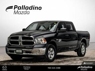 <b>4 NEW ALL SEASON TIRES - NEW FRONT AND REAR BRAKE PADS AND ROTORS <br><br>Low Mileage, Aluminum Wheels,  Remote Keyless Entry,  Fog Lamps,  Rear Camera,  Cruise Control!<br> <br></b><br>     Reliable, dependable, and innovative, this Ram 1500 Classic proves that it has what it takes to get the job done right. This  2019 Ram 1500 Classic is fresh on our lot in Sudbury. <br> <br>The reasons why this Ram 1500 Classic stands above its well-respected competition are evident: uncompromising capability, proven commitment to safety and security, and state-of-the-art technology. From its muscular exterior to the well-trimmed interior, this 2019 Ram 1500 Classic is more than just a workhorse. Get the job done in comfort and style while getting a great value with this amazing full size truck. This low mileage  Crew Cab 4X4 pickup  has just 51,904 kms. Its  black in colour  . It has an automatic transmission and is powered by a  5.7L V8 16V MPFI OHV engine.  It may have some remaining factory warranty, please check with dealer for details. <br> <br> Our 1500 Classics trim level is SLT. Stepping up to this 1500 Classic SLT is an excellent choice as this hard working truck comes loaded with chrome exterior accents and chrome bumpers, stylish aluminum wheels, remote keyless entry, front fog lights, heavy-duty shock absorbers, electronic stability control and trailer sway control. Additional features include rear power-sliding window, ParkView rear back-up camera, cruise control, air conditioning, an touchscreen infotainment hub, automatic headlights and much more. This vehicle has been upgraded with the following features: Aluminum Wheels,  Remote Keyless Entry,  Fog Lamps,  Rear Camera,  Cruise Control,  Streaming Audio,  Touchscreen. <br> To view the original window sticker for this vehicle view this <a href=http://www.chrysler.com/hostd/windowsticker/getWindowStickerPdf.do?vin=1C6RR7LT0KS505014 target=_blank>http://www.chrysler.com/hostd/windowsticker/getWindowStickerPdf.do?vin=1C6RR7LT0KS505014</a>. <br/><br> <br>To apply right now for financing use this link : <a href=https://www.palladinomazda.ca/finance/ target=_blank>https://www.palladinomazda.ca/finance/</a><br><br> <br/><br>Palladino Mazda in Sudbury Ontario is your ultimate resource for new Mazda vehicles and used Mazda vehicles. We not only offer our clients a large selection of top quality, affordable Mazda models, but we do so with uncompromising customer service and professionalism. We takes pride in representing one of Canadas premier automotive brands. Mazda models lead the way in terms of affordability, reliability, performance, and fuel efficiency.The advertised price is for financing purchases only. All cash purchases will be subject to an additional surcharge of $2,501.00. This advertised price also does not include taxes and licensing fees.<br> Come by and check out our fleet of 80+ used cars and trucks and 80+ new cars and trucks for sale in Sudbury.  o~o