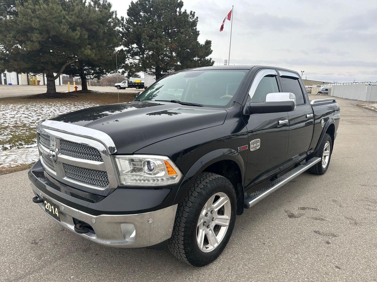 2014 RAM 1500 4WD Crew Cab 149" LARAMIE LONGHORN - Photo #1