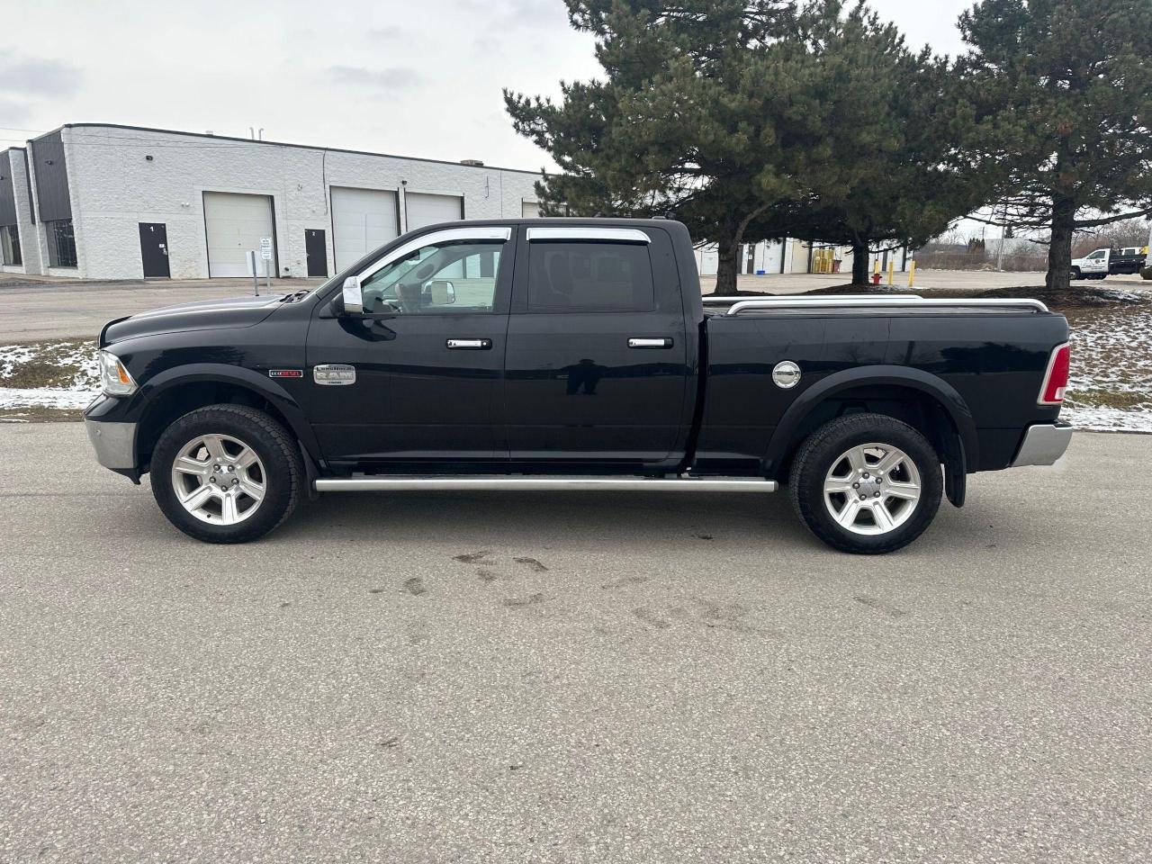 2014 RAM 1500 4WD Crew Cab 149" LARAMIE LONGHORN - Photo #2